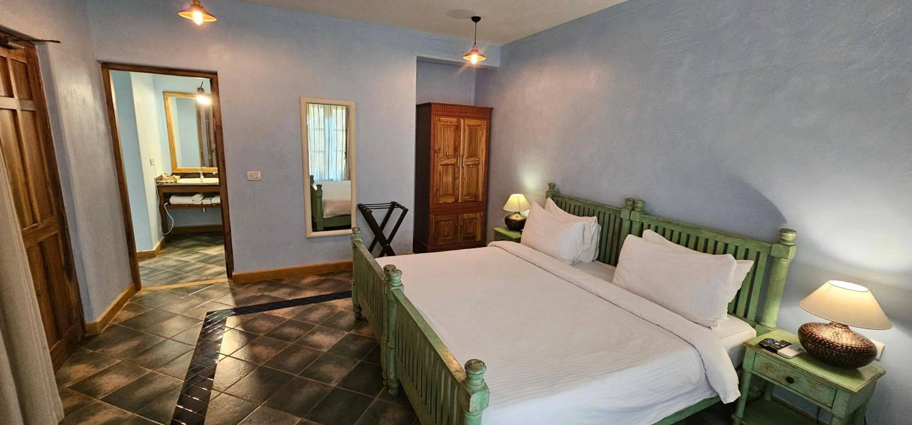 Bed in Amritara Aura Resort & Spa