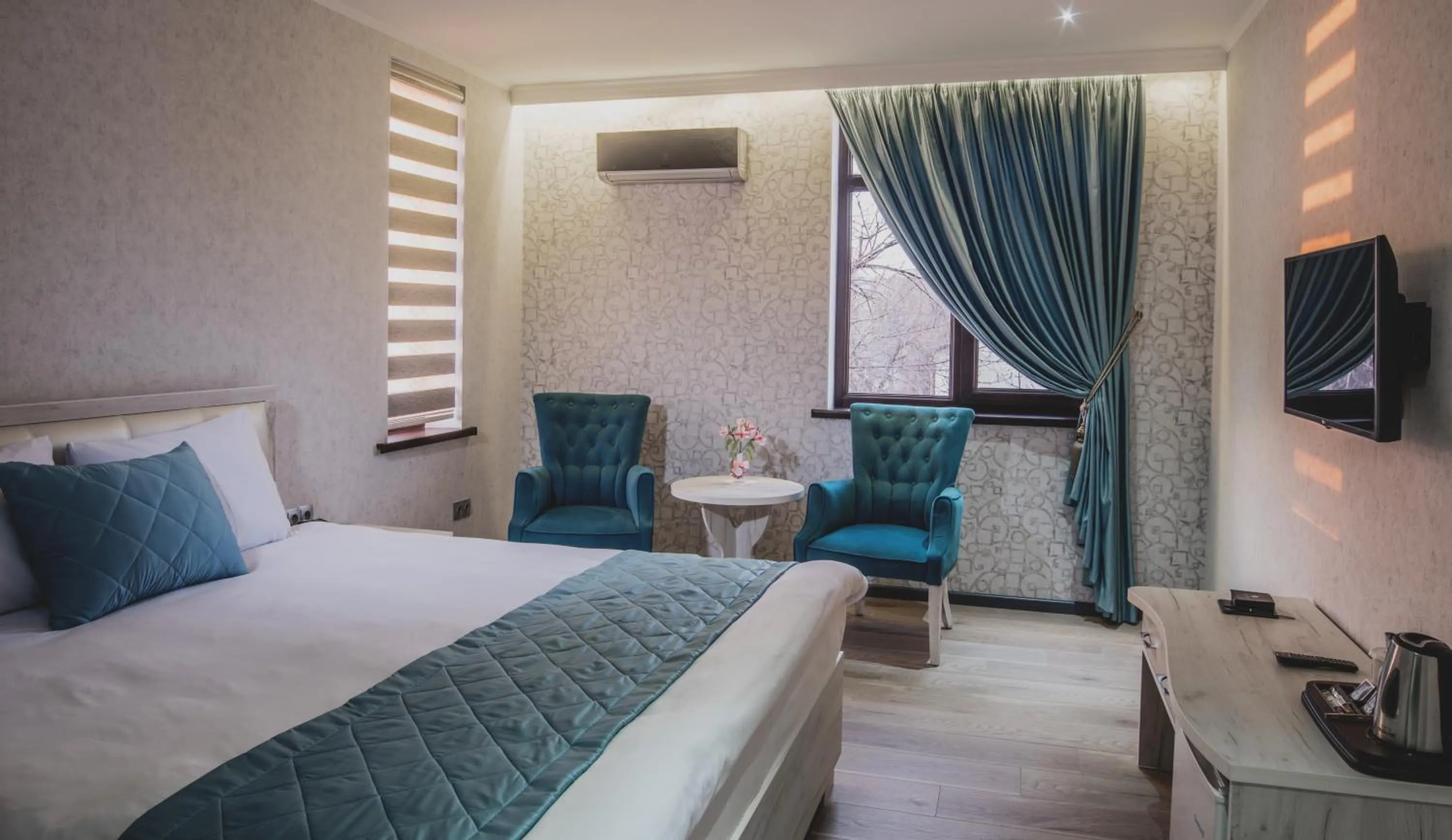 Bed in Aster Hotel Group