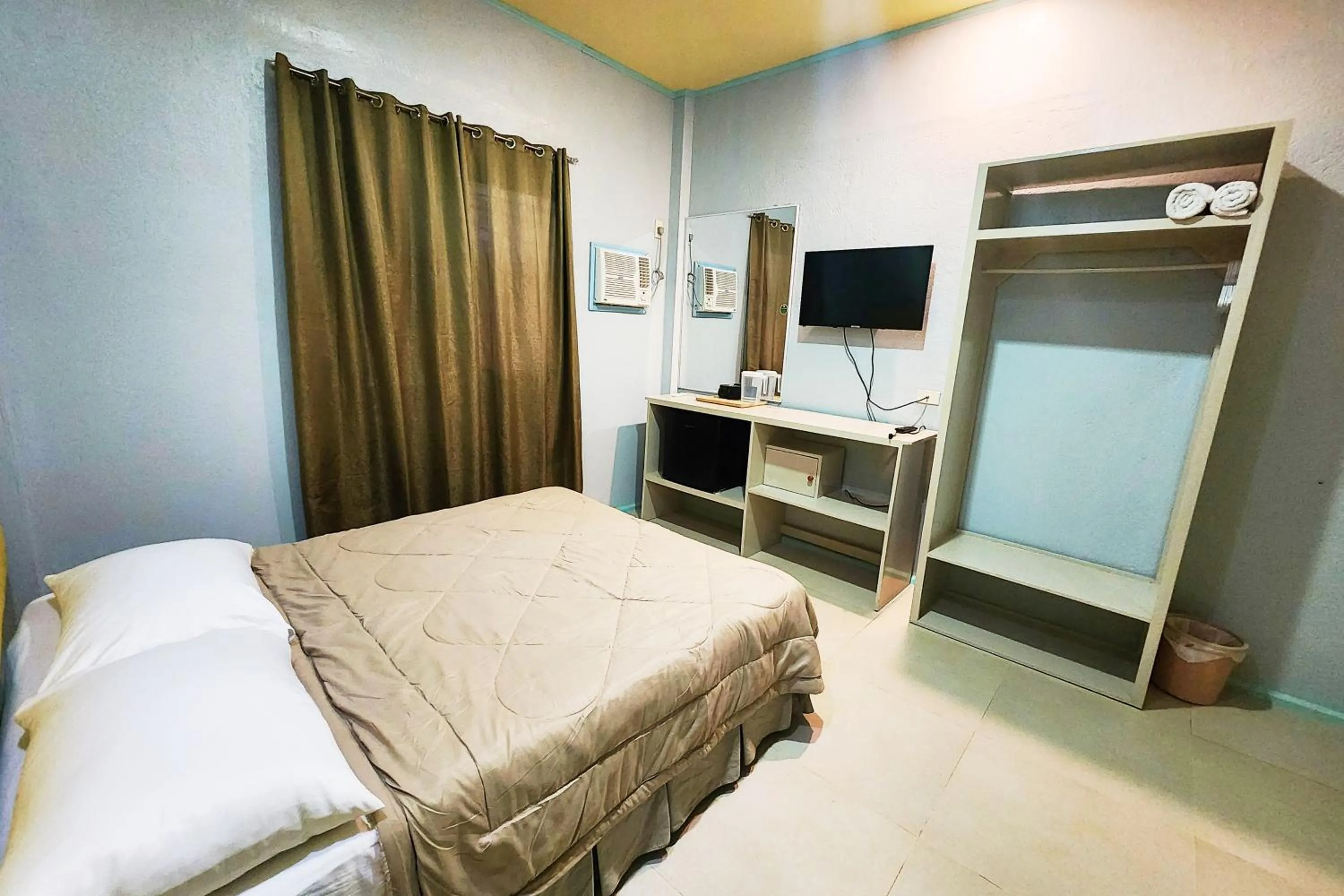 Bed in MJs Garden Hotel Moalboal powered by Cocotel
