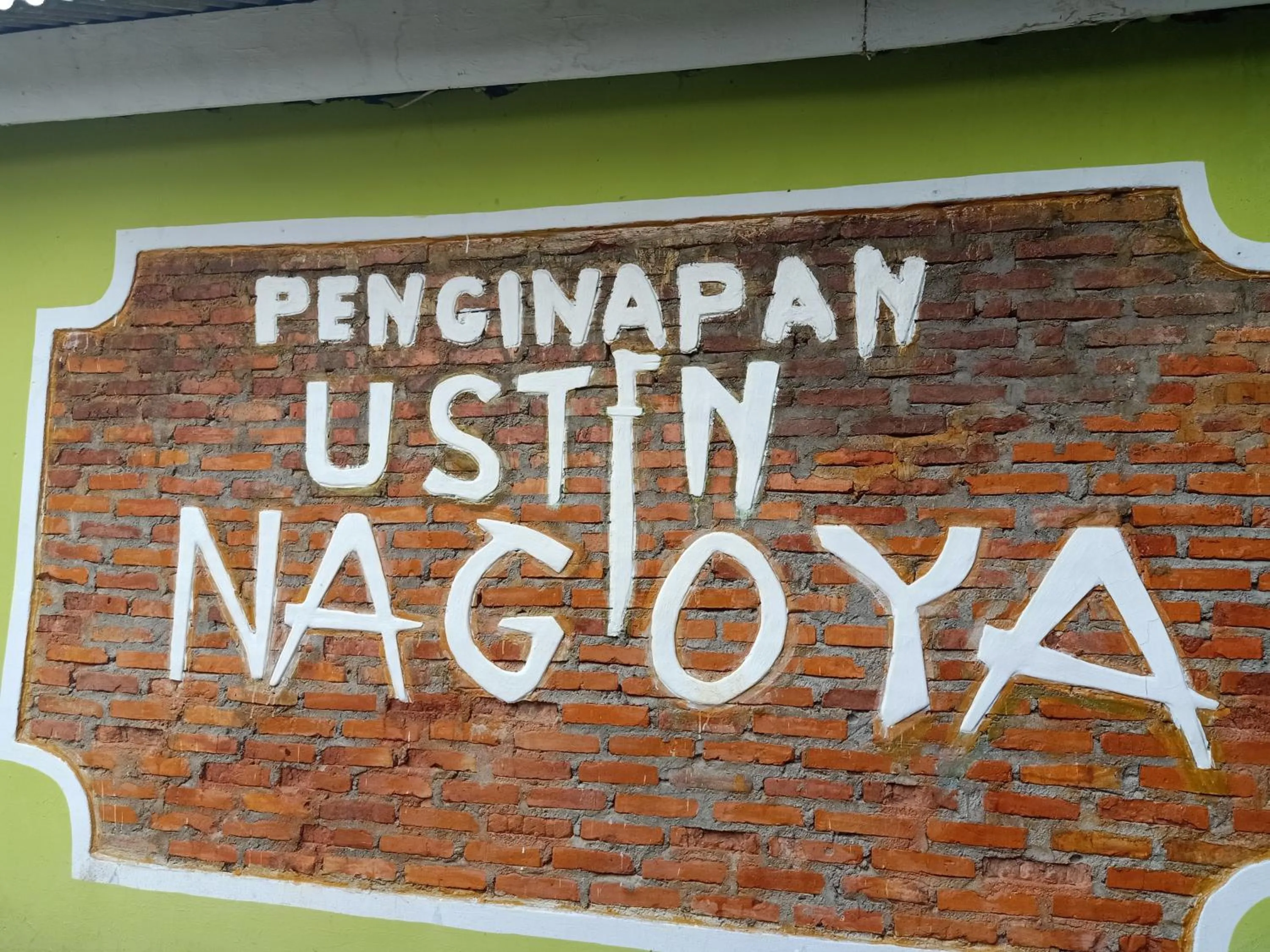 Property logo or sign in Ustin Nagoya Bukit Lawang Orangutan Trekking & transport only book with us