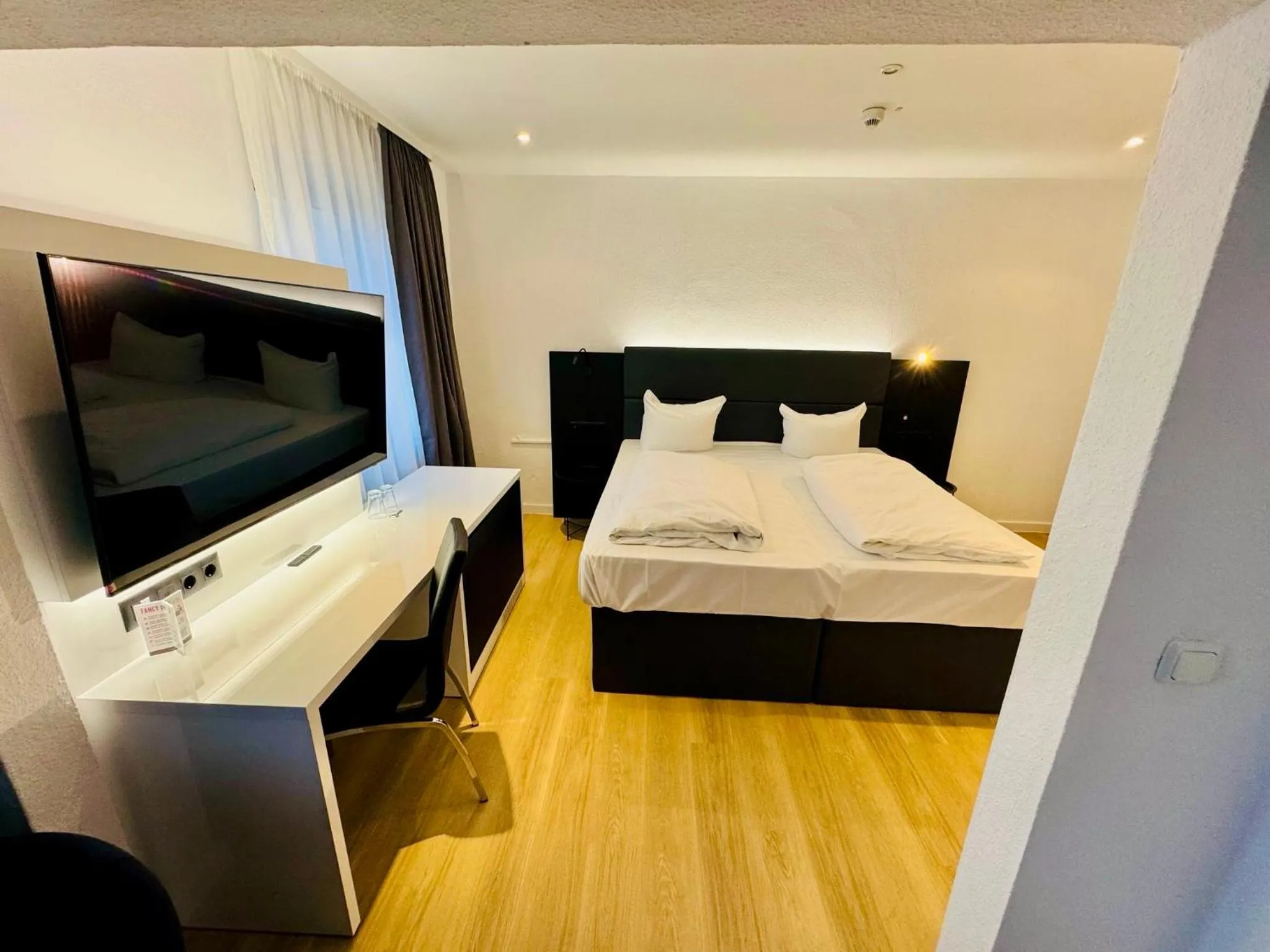 Bed in DORMERO Hotel Wilhelmshaven