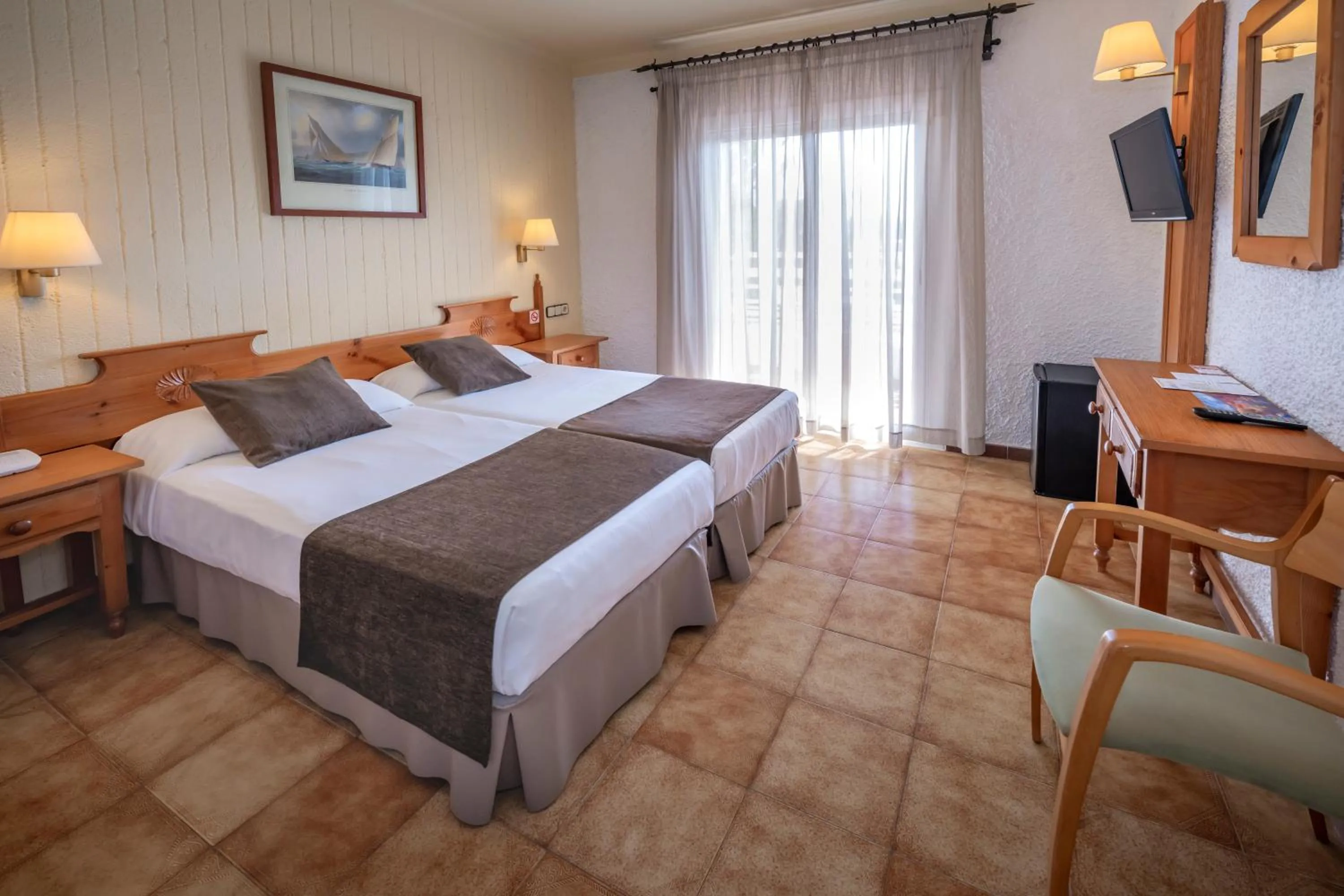 Photo of the whole room, Bed in Hotel GHT Neptuno-Tossa & Venus SPA