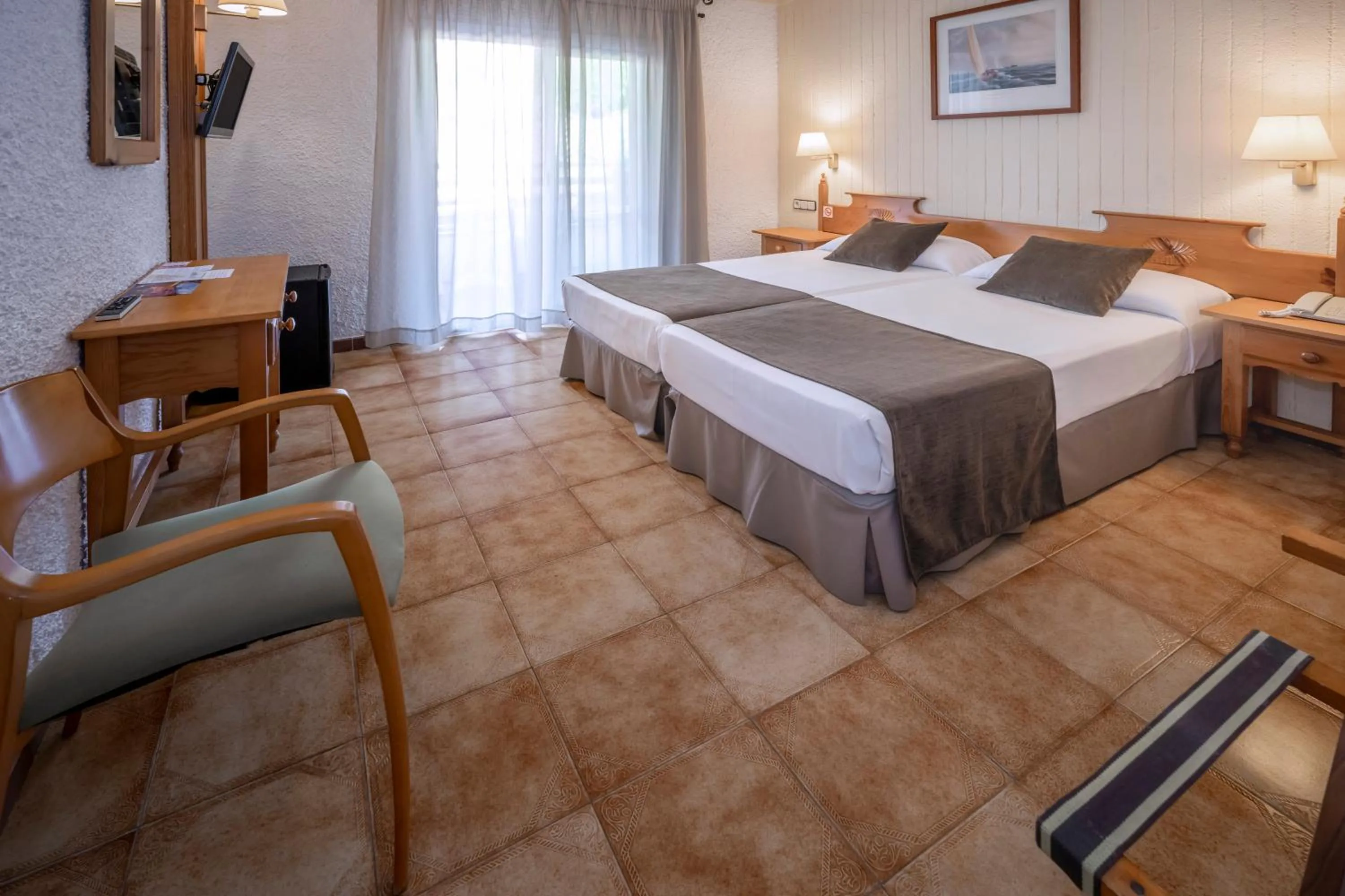 Photo of the whole room, Bed in Hotel GHT Neptuno-Tossa & Venus SPA