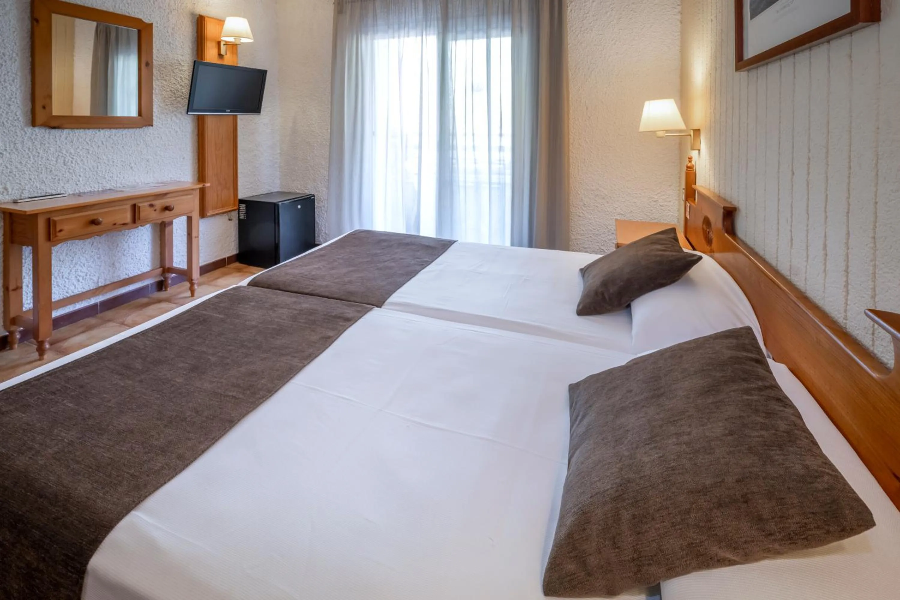 Photo of the whole room, Bed in Hotel GHT Neptuno-Tossa & Venus SPA