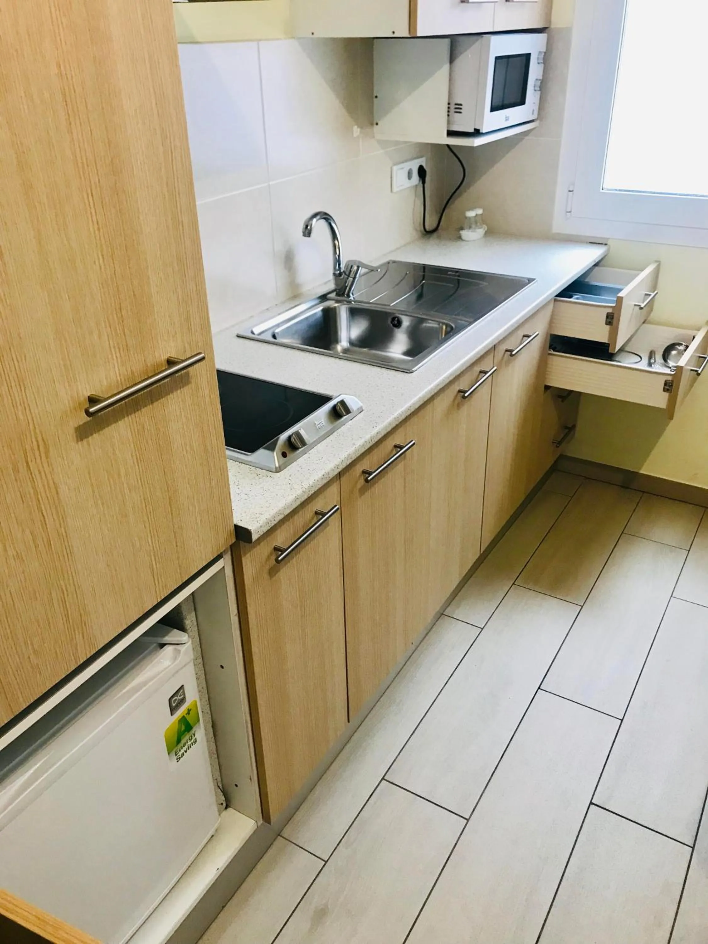 Kitchen or kitchenette in Apartamentos Giuliano