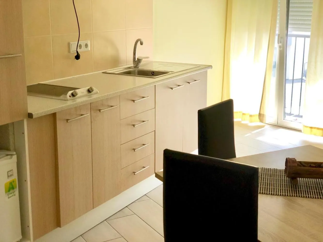 Kitchen or kitchenette in Apartamentos Giuliano
