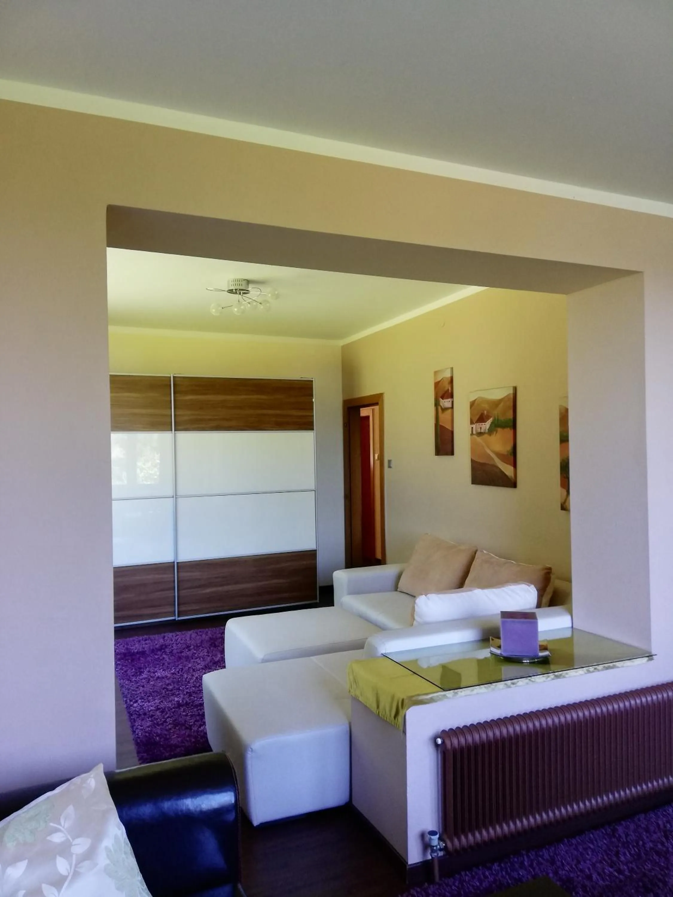 Living room, Bed in Hotel Faaker See Inn by S4Y