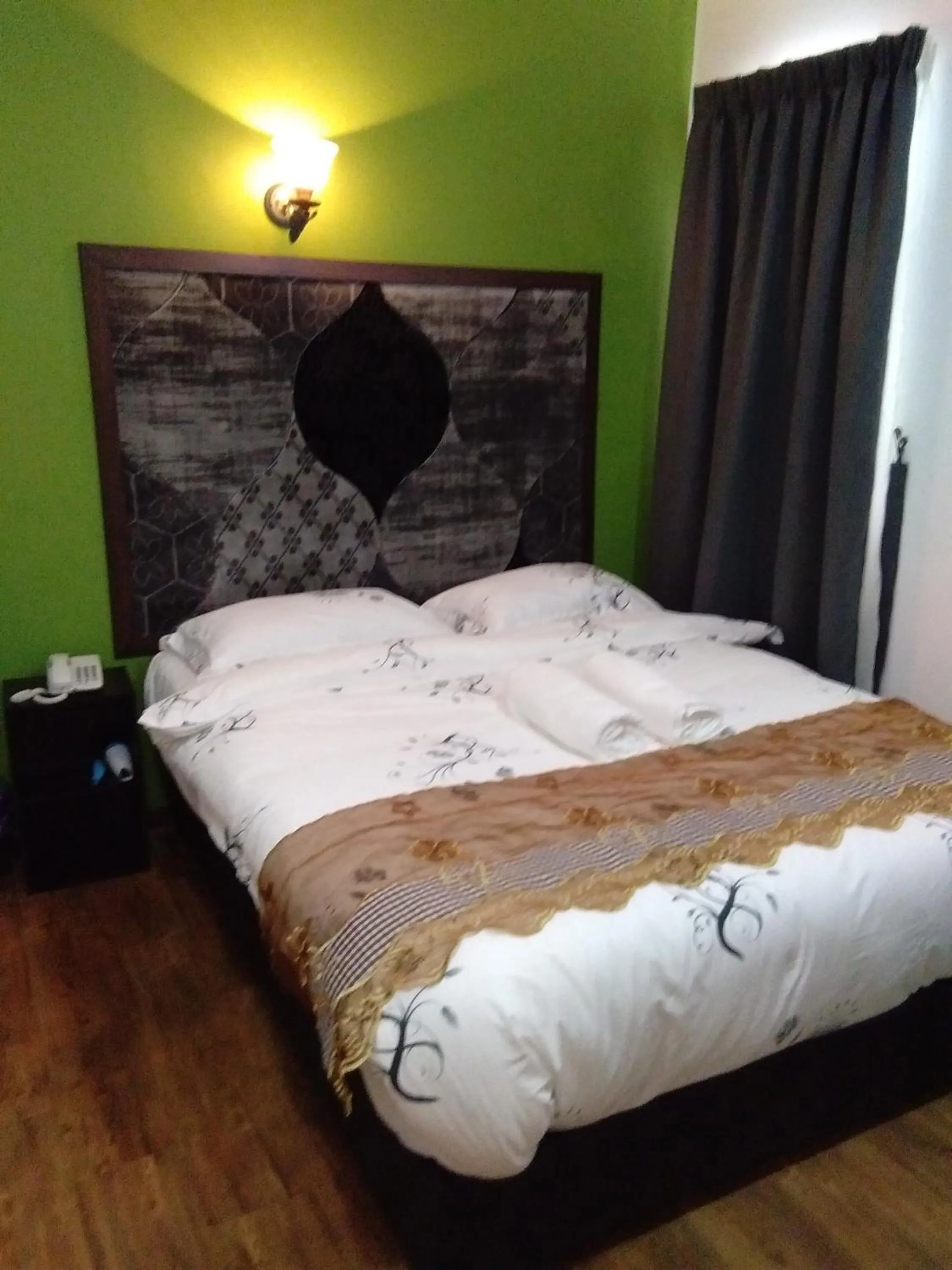 Bedroom in PI Grand Hotel