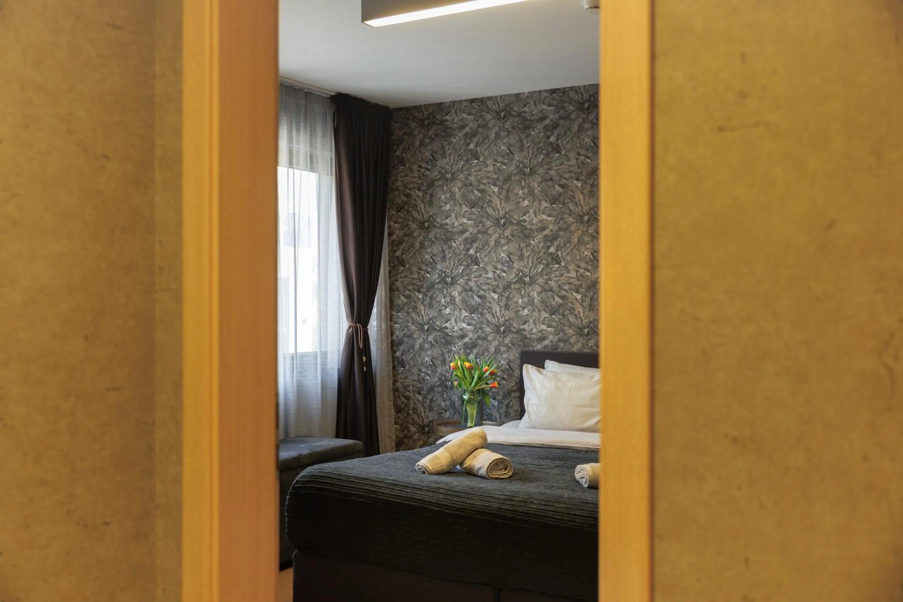 Living room, Bed in City Center Apartments with Parking