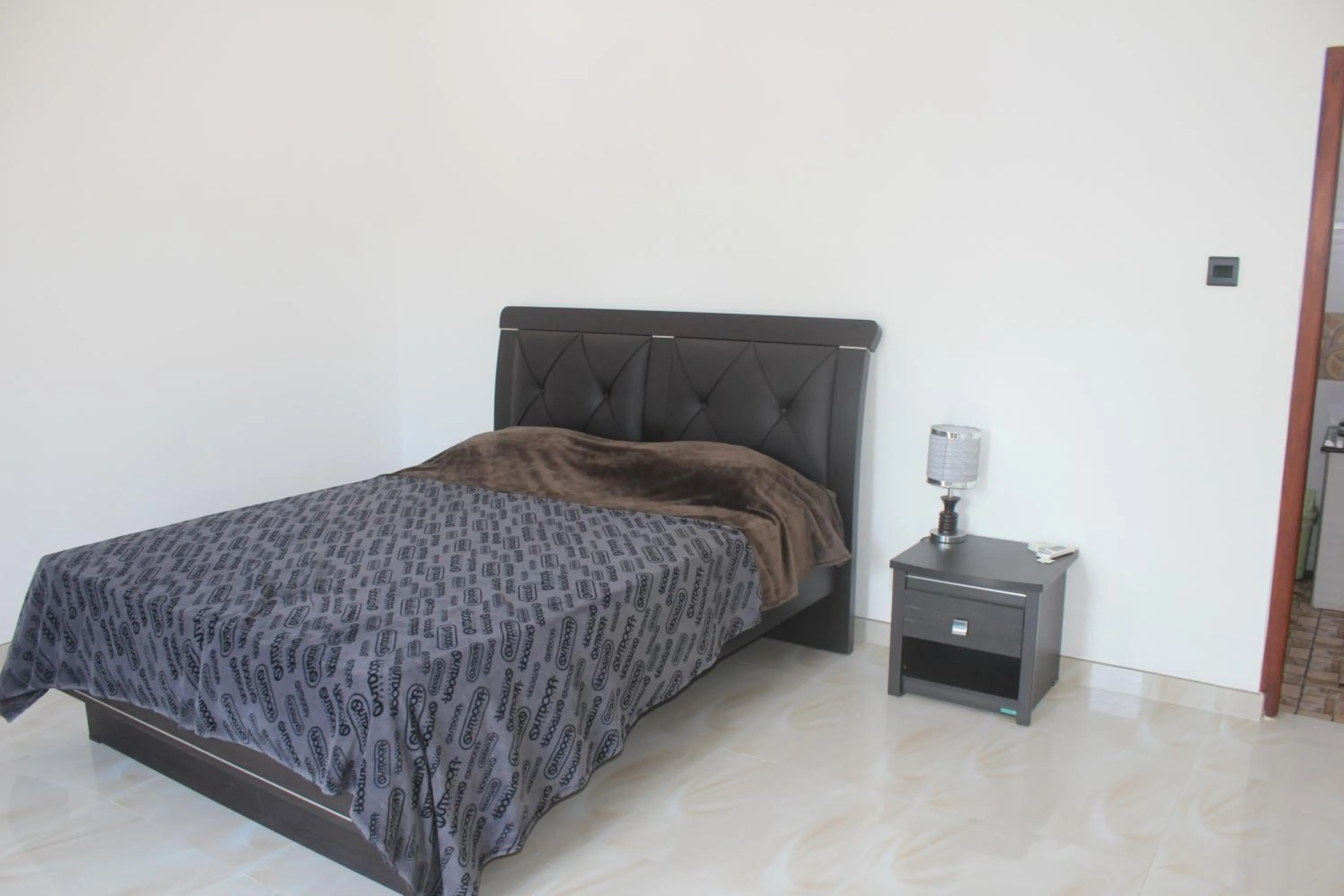 Bed in White Elephant Villa & Restaurant