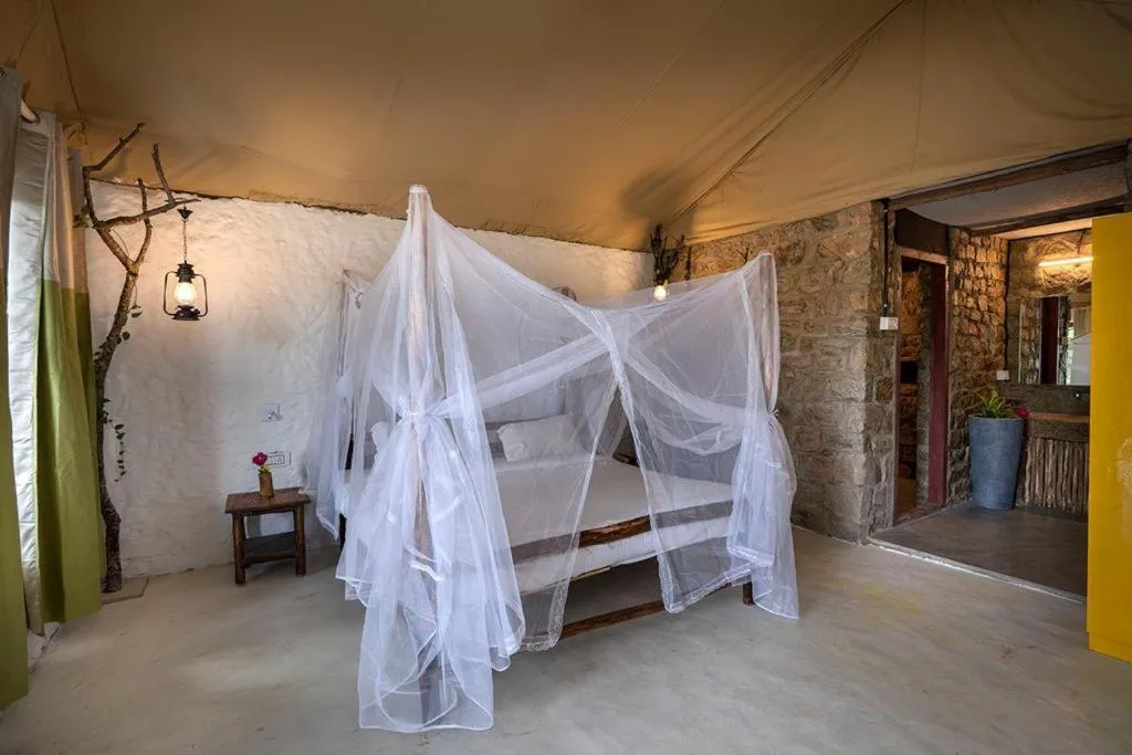 Bed in Deshadan Eco Valley Resort - An Eco friendly Mud House