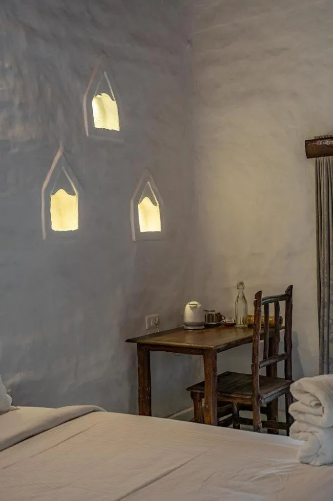 Bed in Deshadan Eco Valley Resort - An Eco friendly Mud House