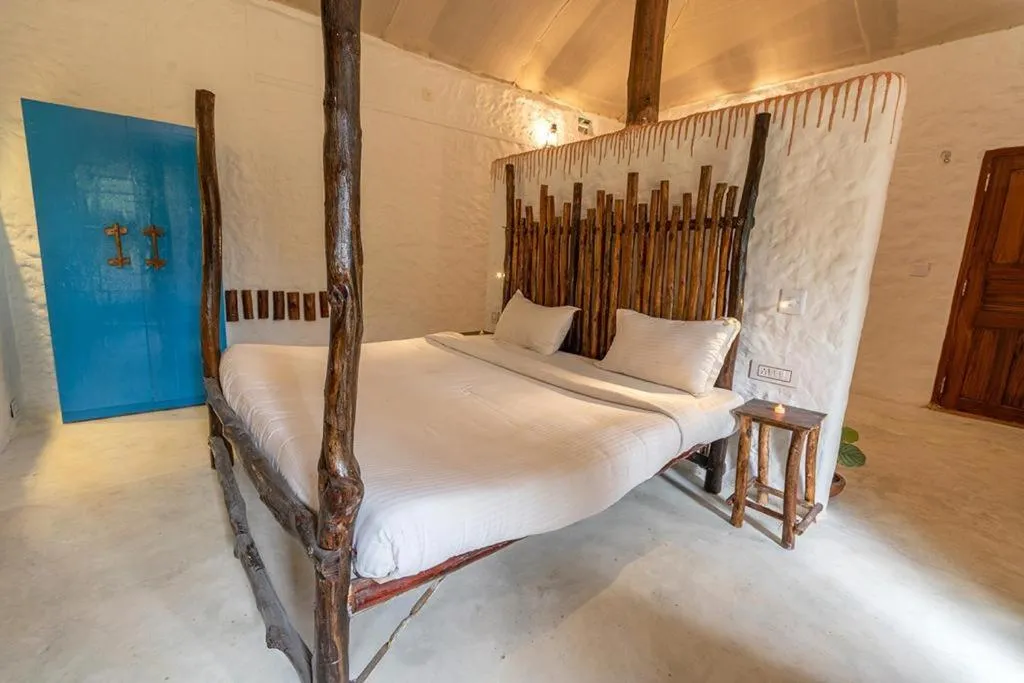 Bed in Deshadan Eco Valley Resort - An Eco friendly Mud House