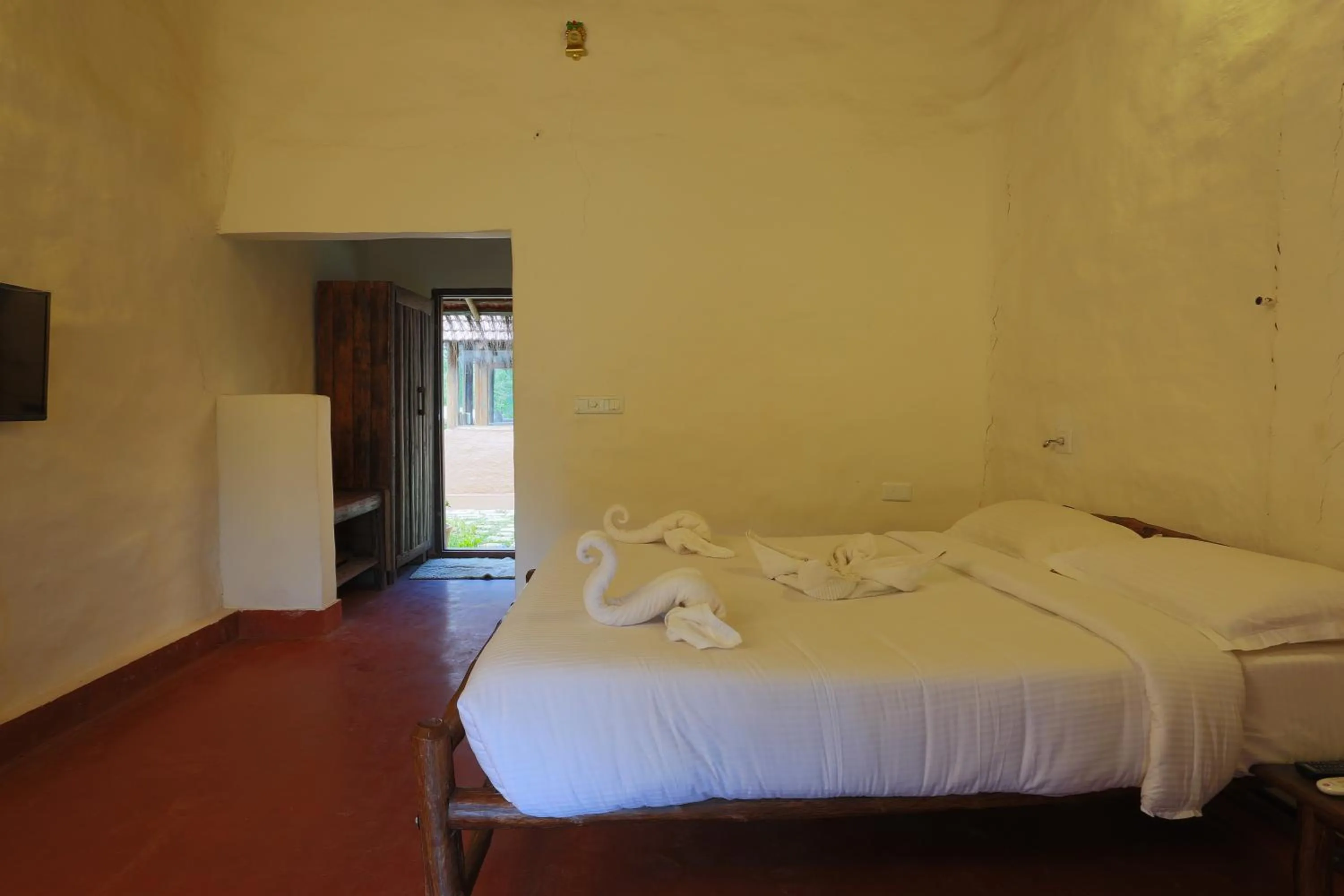Bed in Deshadan Eco Valley Resort - An Eco friendly Mud House