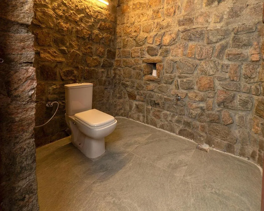 Toilet in Deshadan Eco Valley Resort - An Eco friendly Mud House