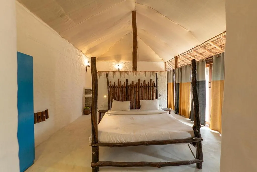Bed in Deshadan Eco Valley Resort - An Eco friendly Mud House