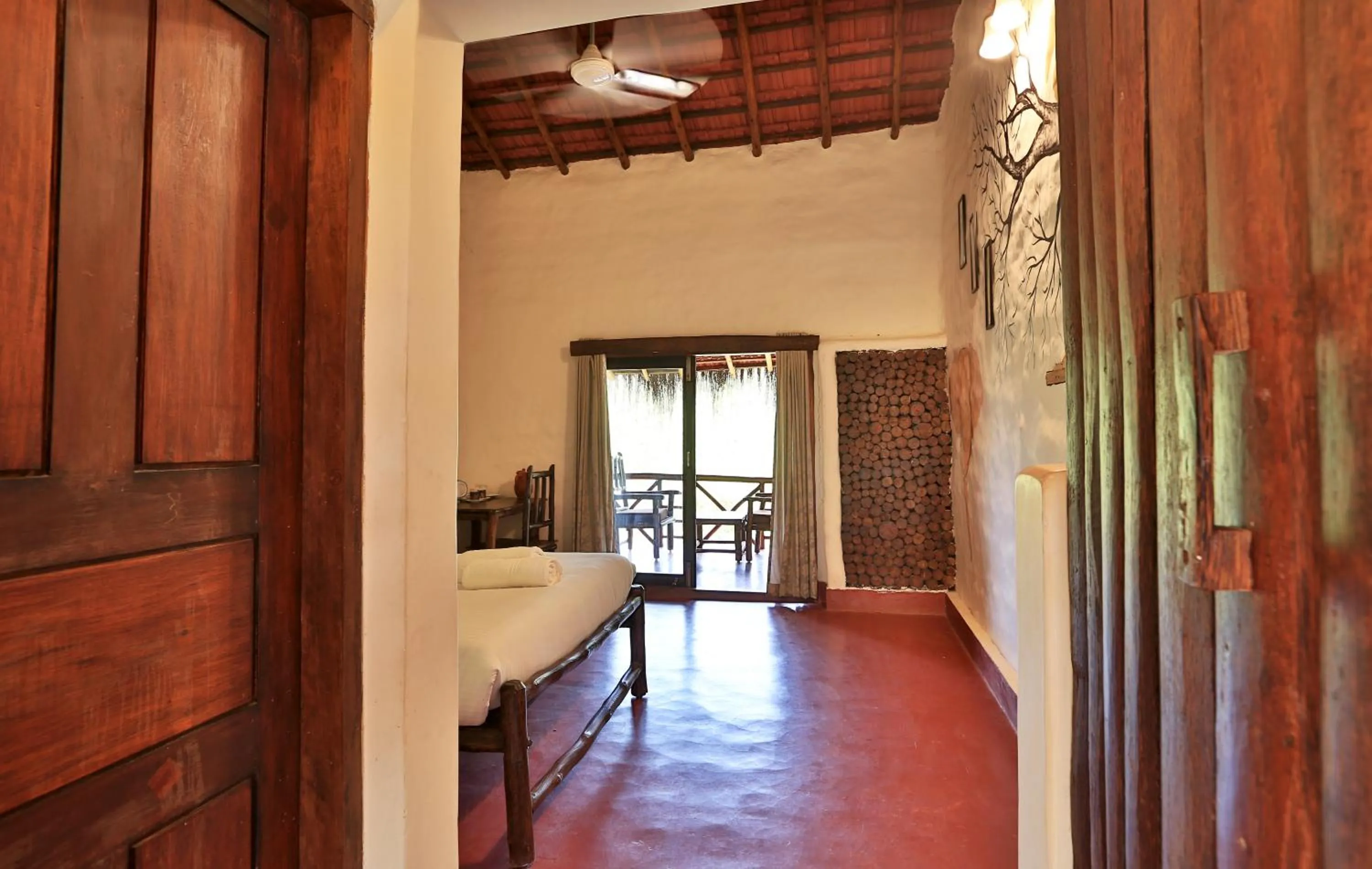 Bed in Deshadan Eco Valley Resort - An Eco friendly Mud House