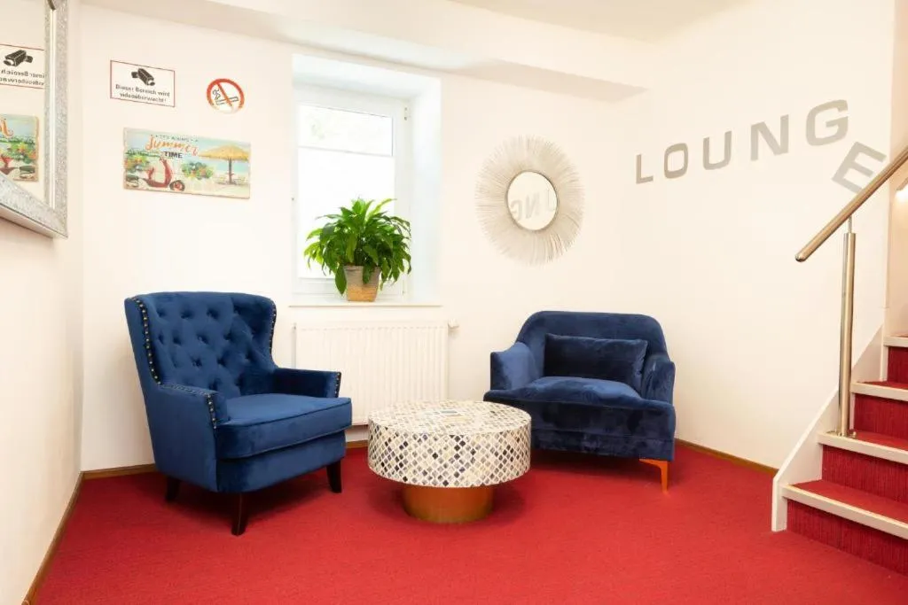 Communal lounge/ TV room in Velden24 - create your own stay