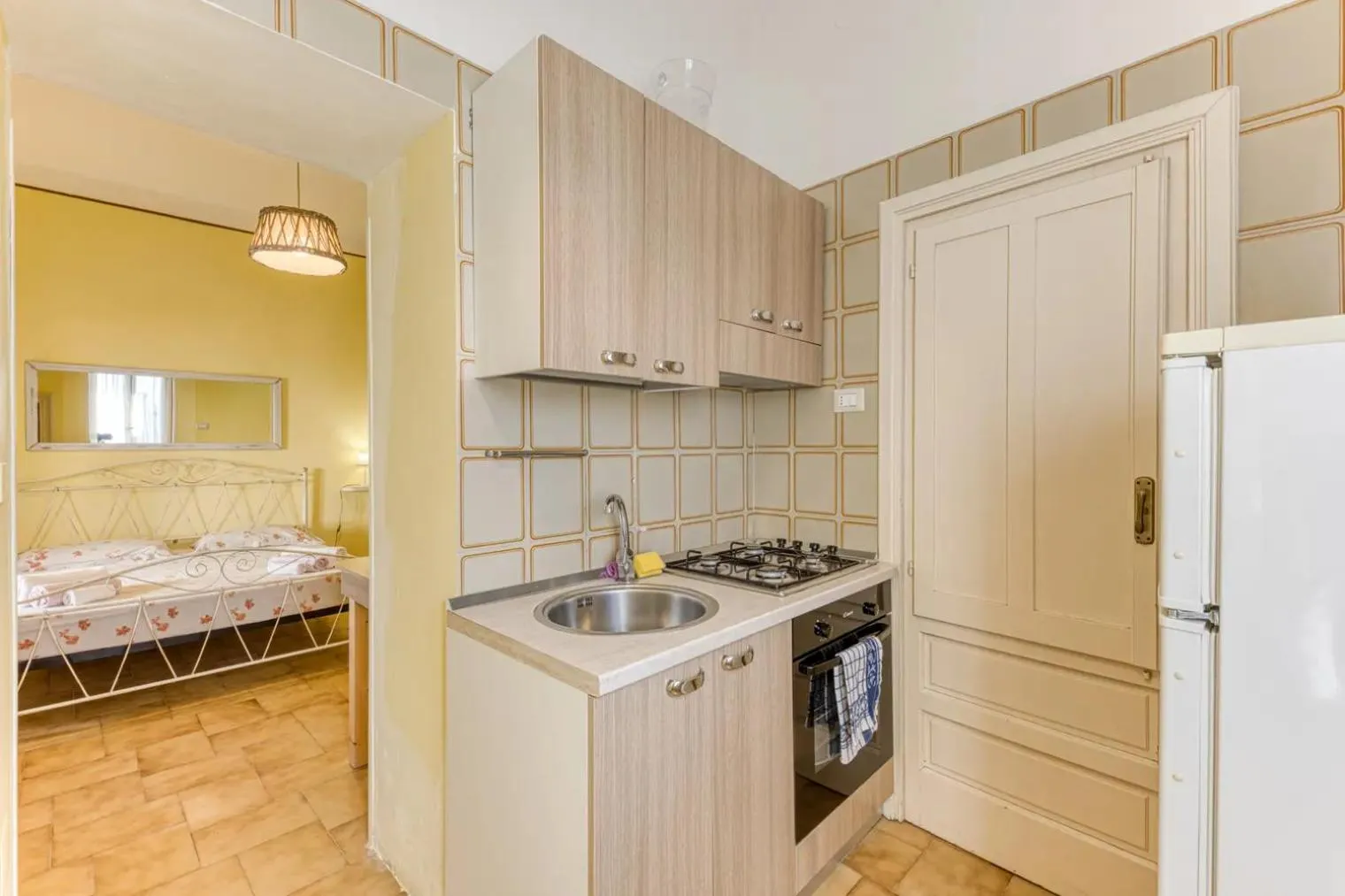 Kitchen or kitchenette, Bed in La Corte dei Mille