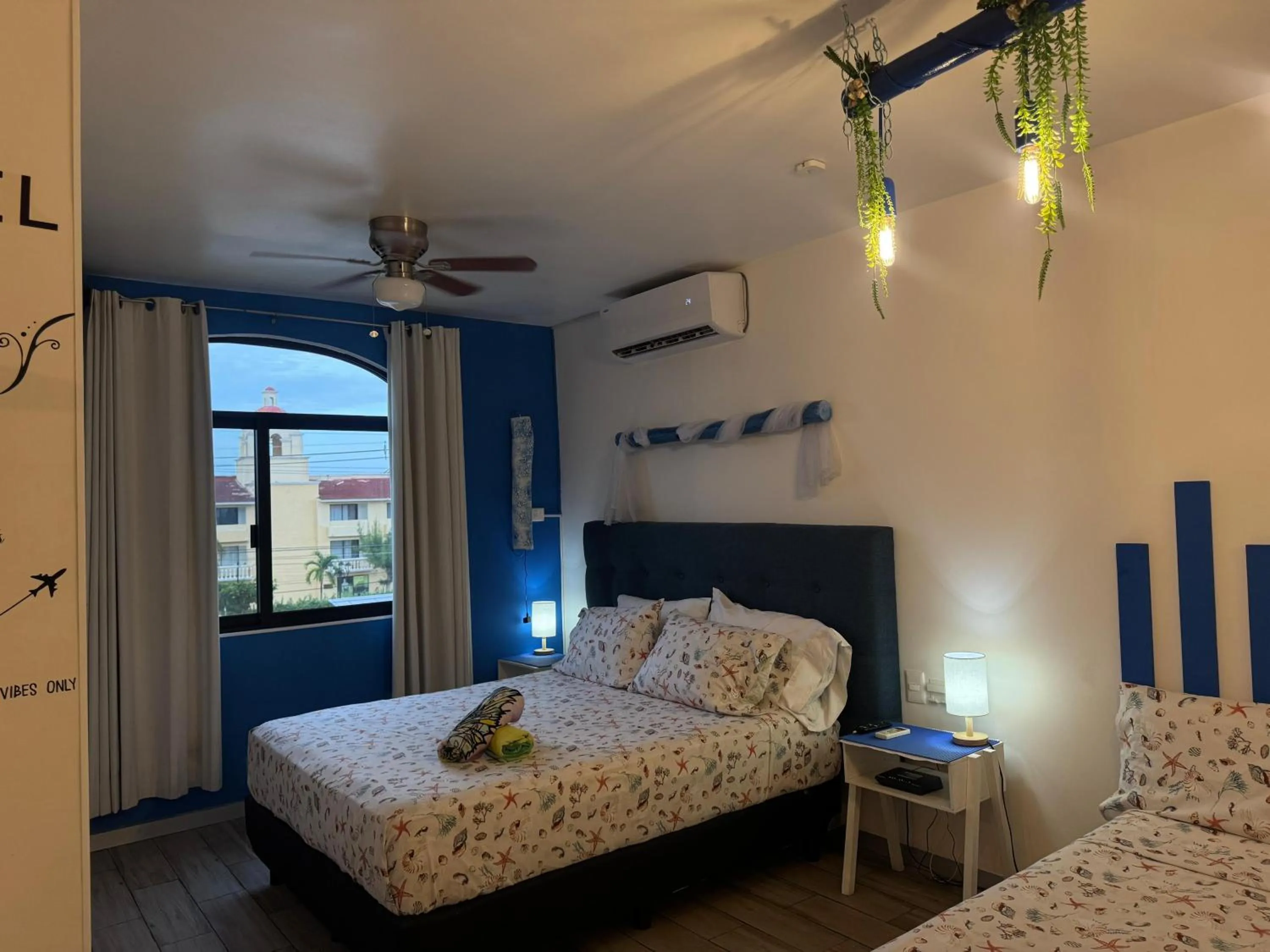 Bed in Tropical apartment