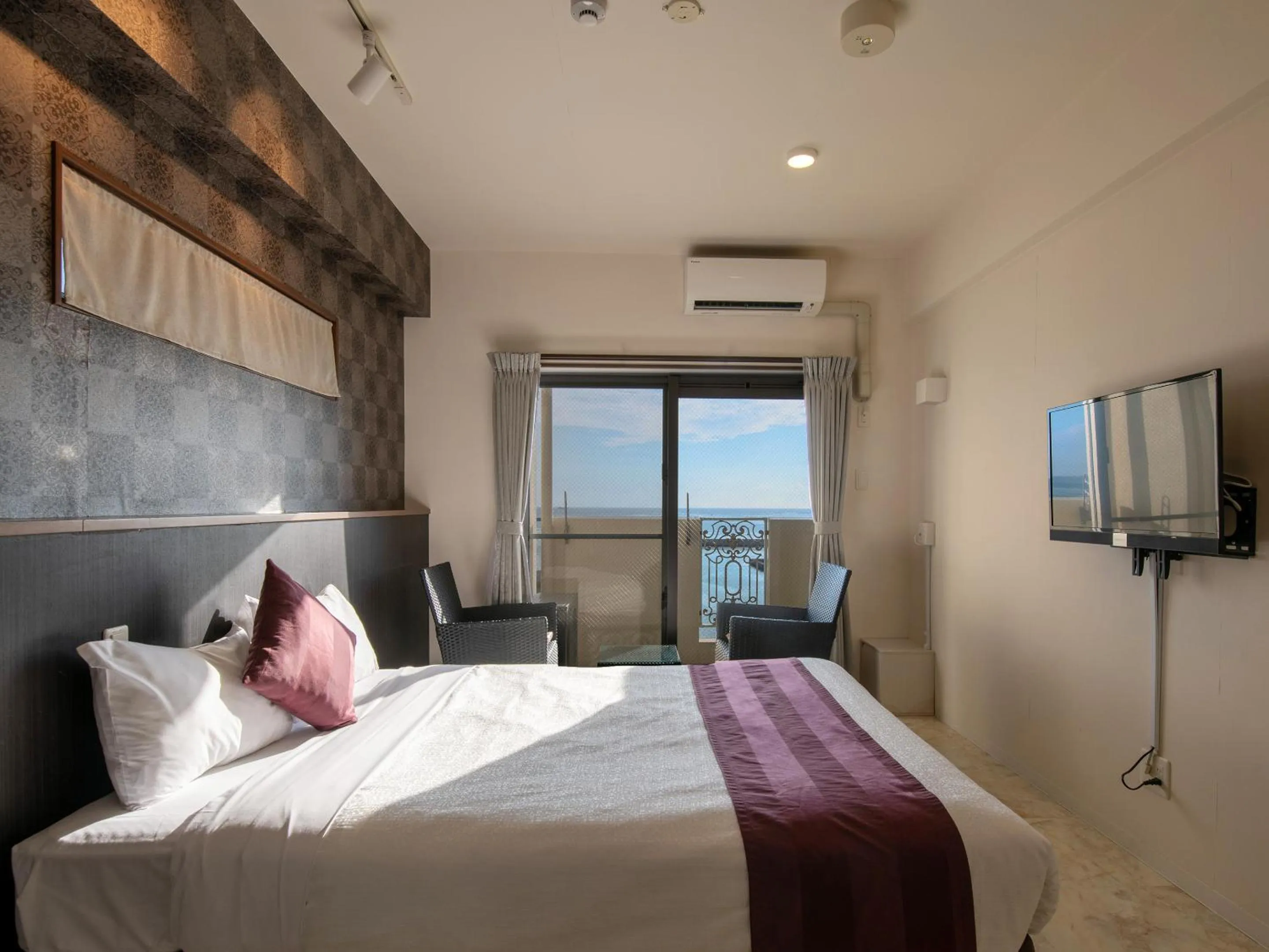 Photo of the whole room, Bed in Cozy Stay In Itoman