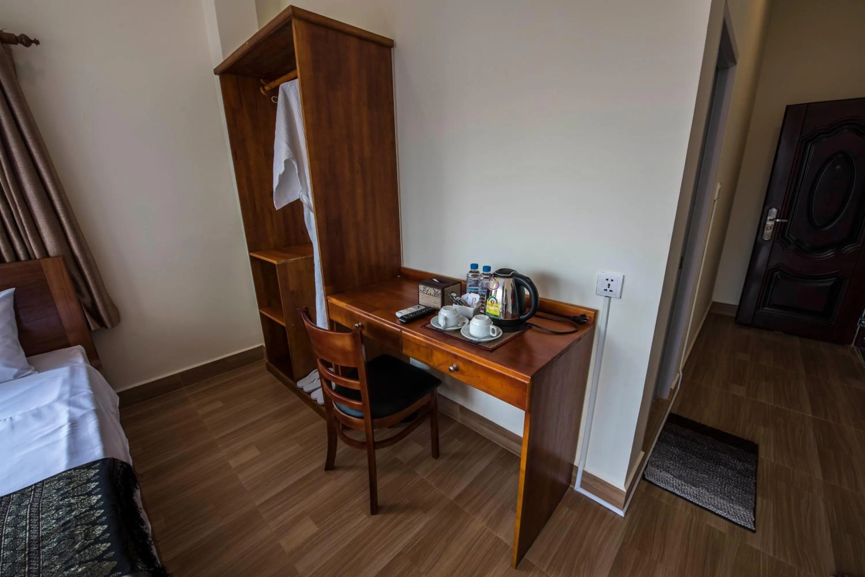 Seating area, Bed in Phnom Penh Le Vincent Hotel