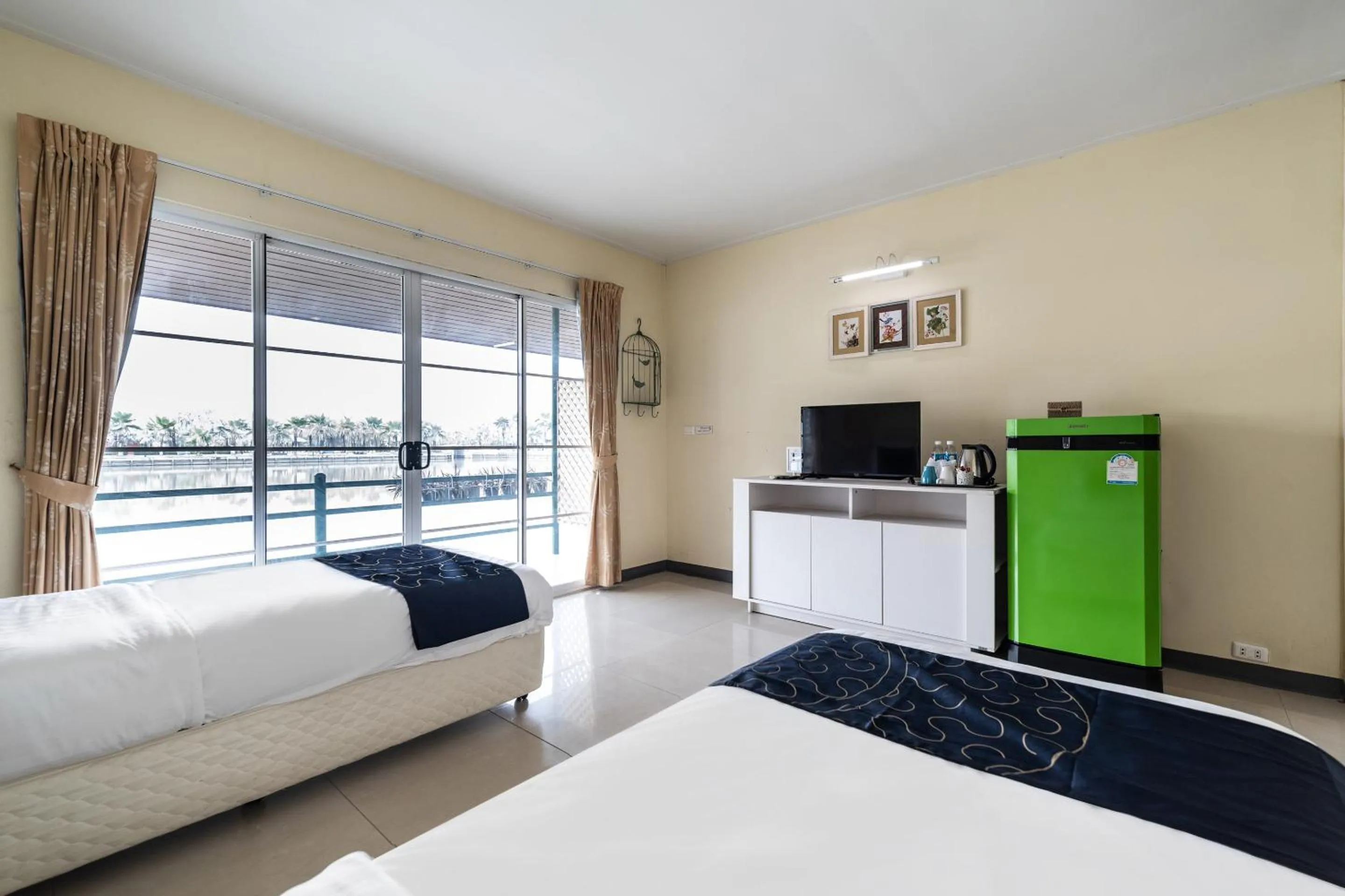 Bedroom in Capital O 805 Suan Palm Farm Nok Resort