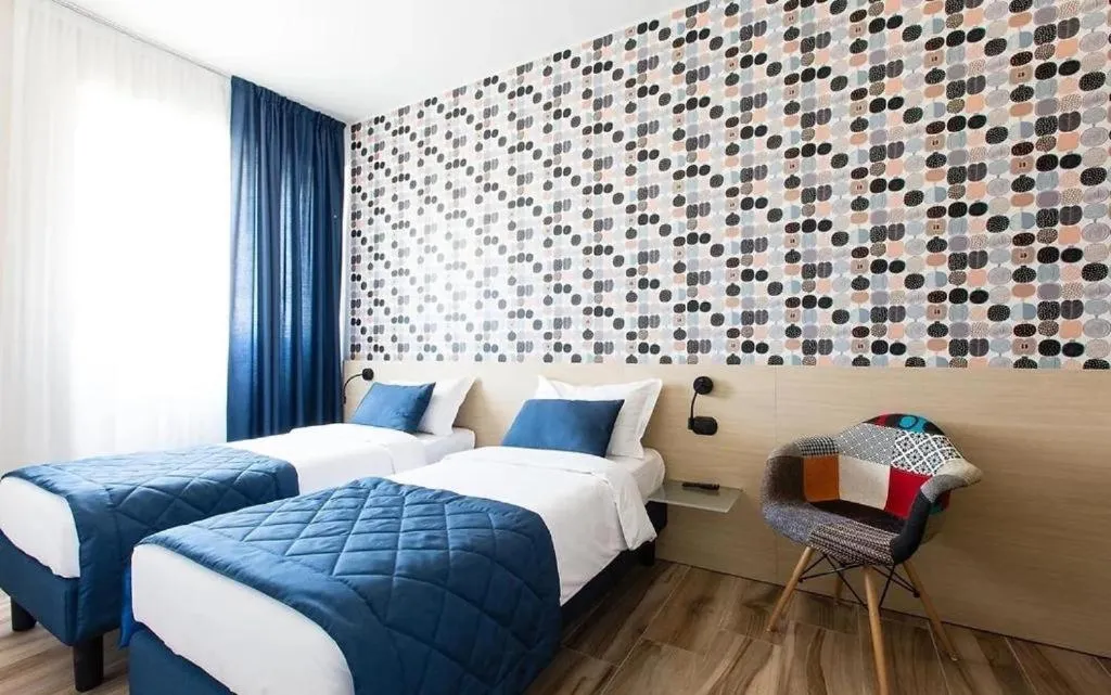 Bed in Aparthotel Isola