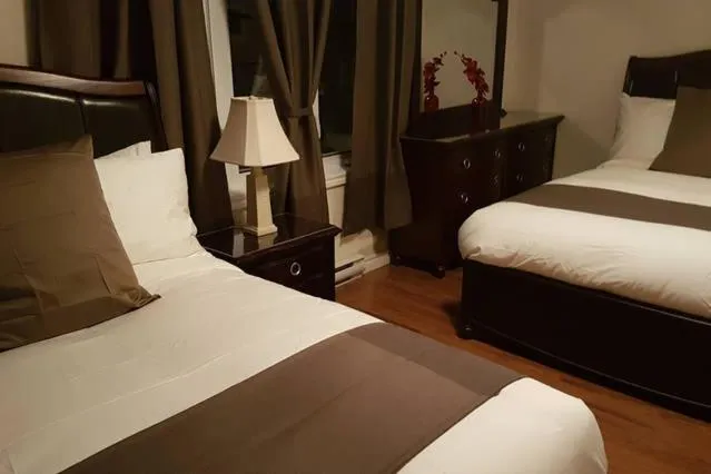 Bed in Two-Bedroom Apartment Sweet #4 by Amazing Property Rentals