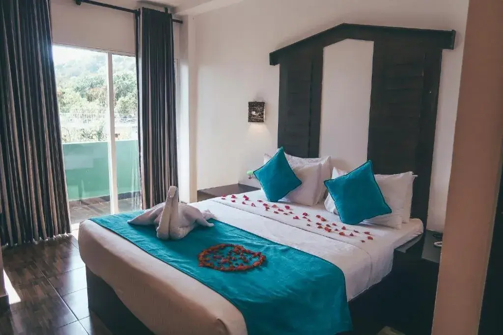 Bed in Sunshine Resort & Spa Sigiriya Bed in Sunshine Resort & Spa Sigiriya