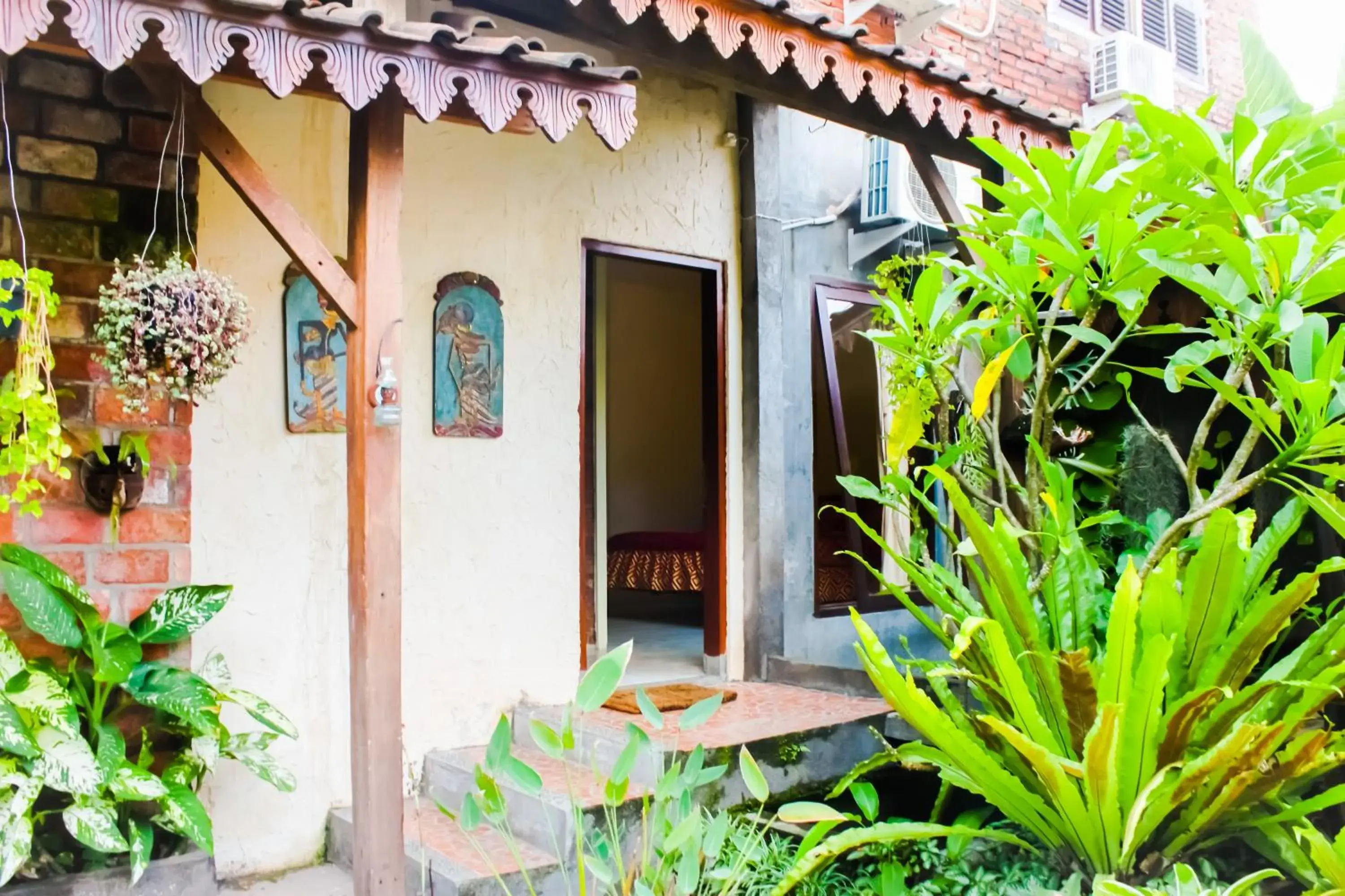 Garden view in Griya Gribig Guest House Mitra RedDoorz Garden view in Griya Gribig Guest House Mitra RedDoorz