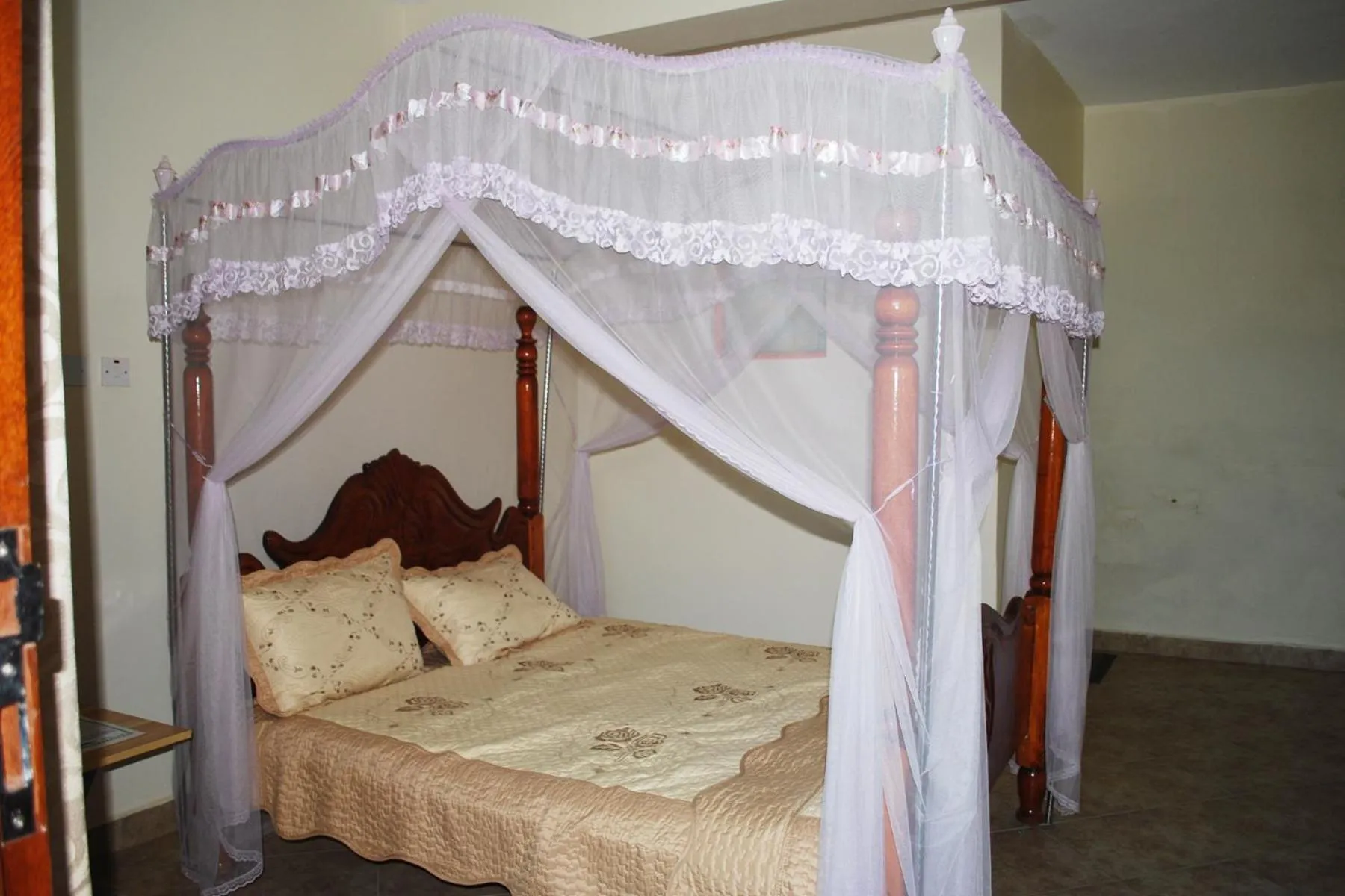 Bed in Relief Motel Fort Portal
