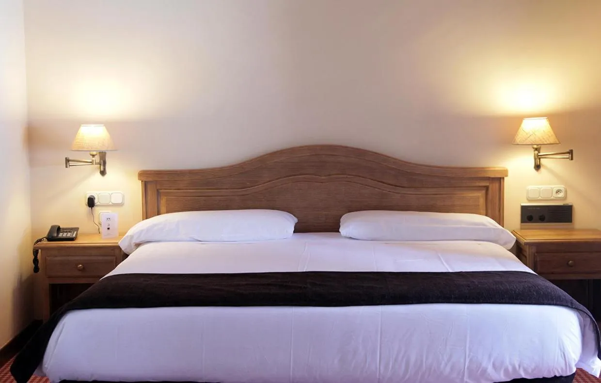 Bed in Hotel Chalet Bassibe