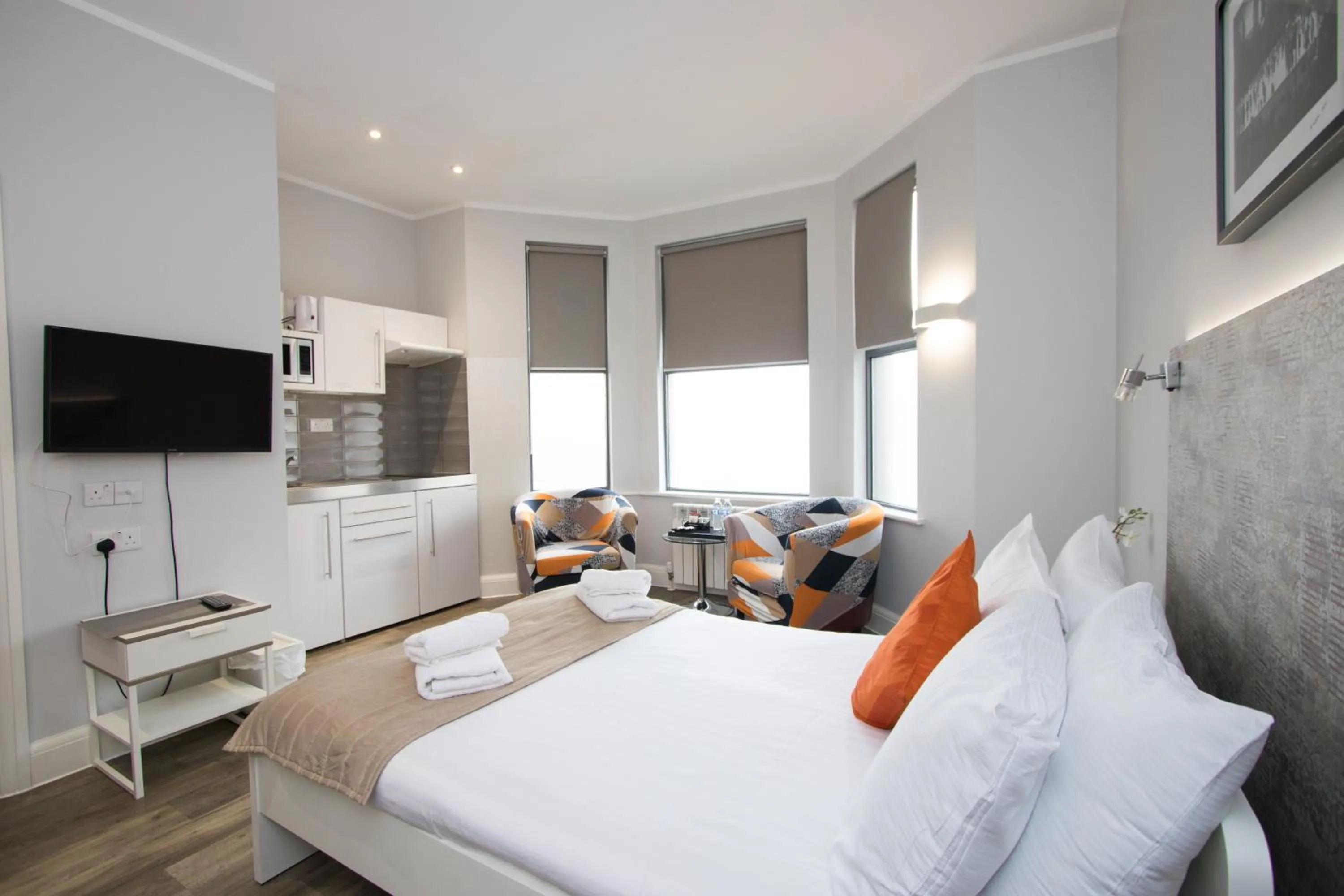 Communal lounge/ TV room, Bed in Westciti Caroco Aparthotel