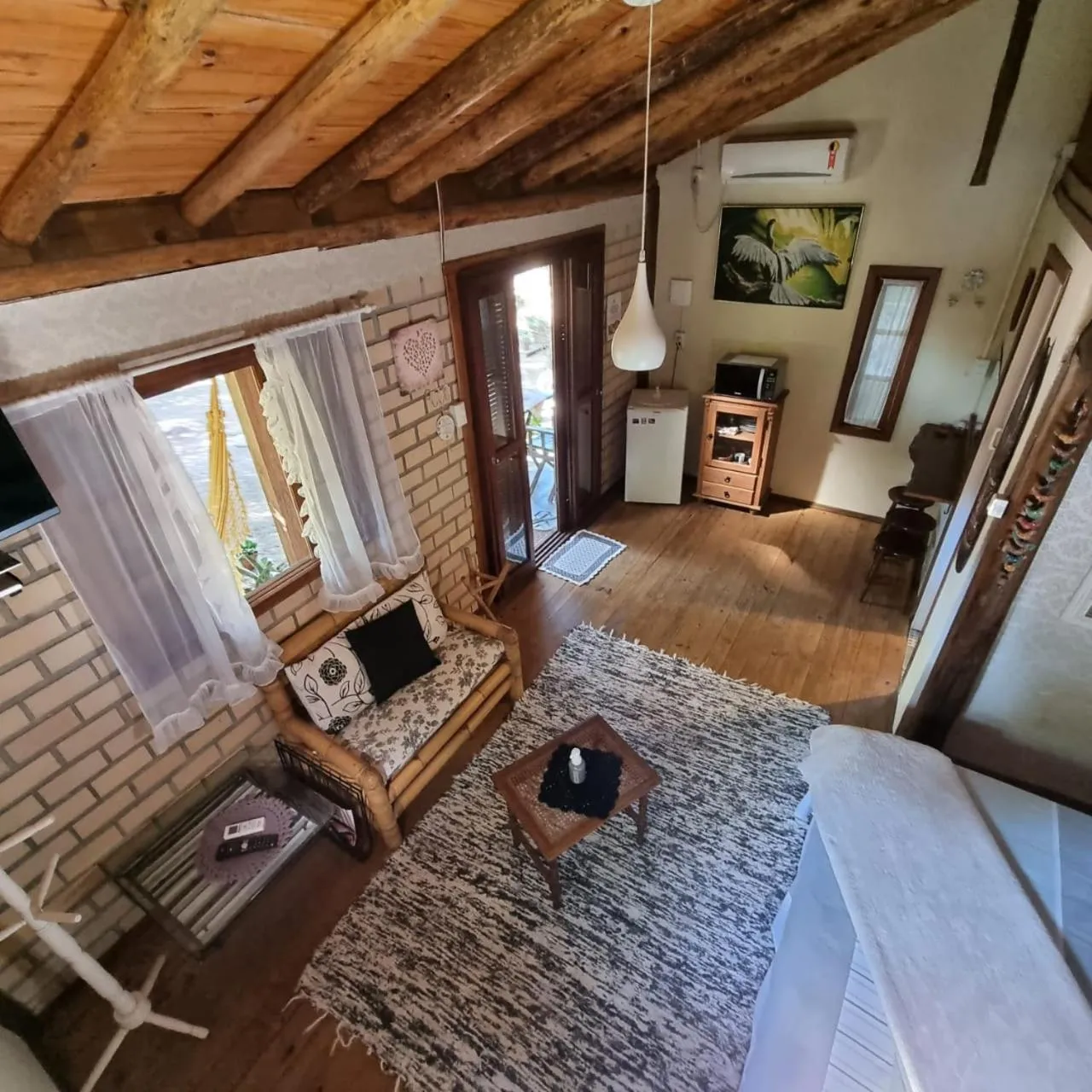 Living room in Pousada Refúgio dos Pássaros