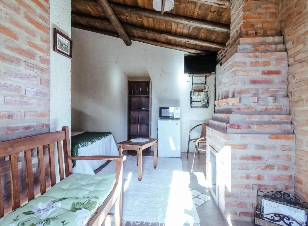 Living room, Bed in Pousada Refúgio dos Pássaros