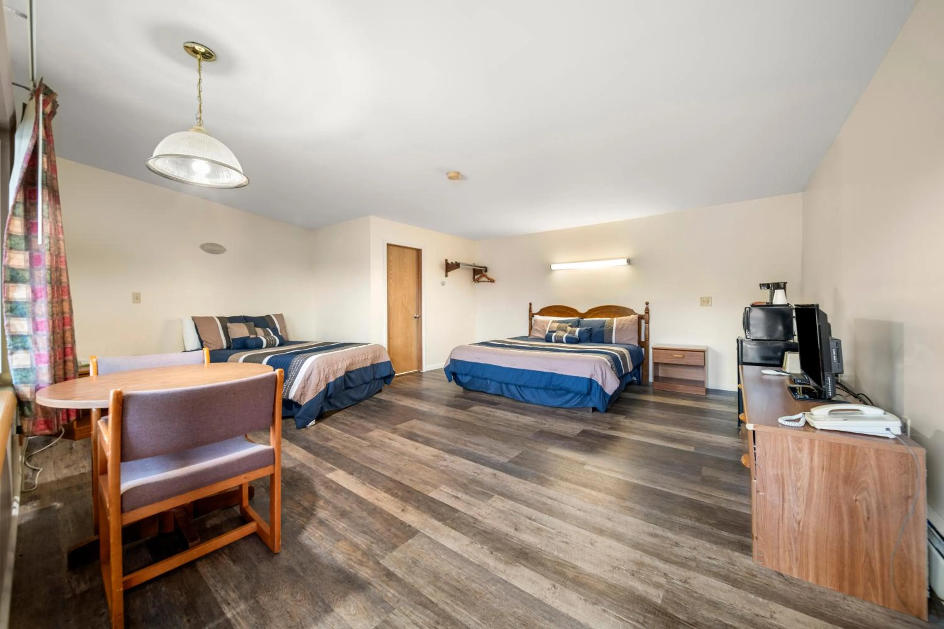 Bed in Thumb Heritage Inn