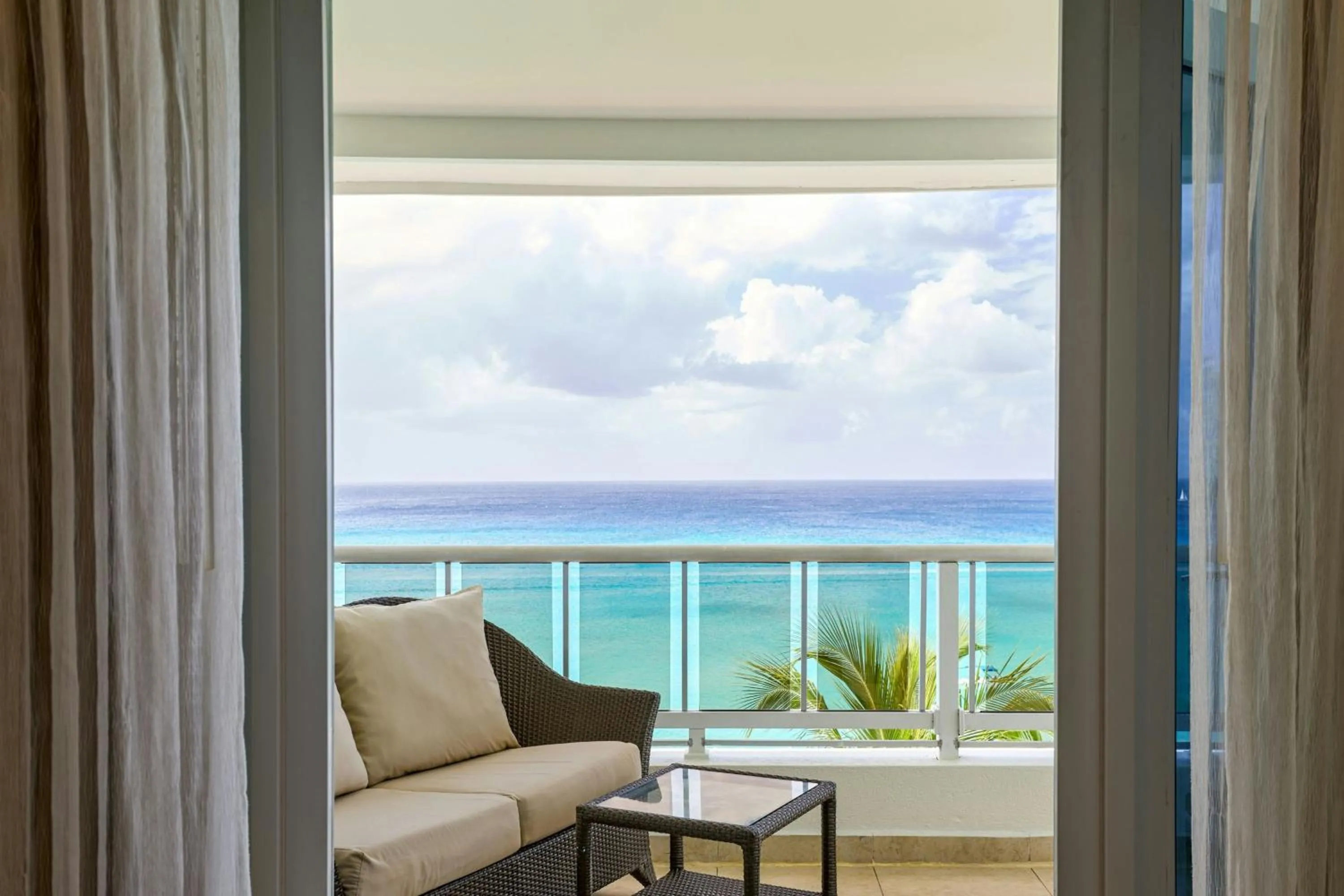 Living room in Waves Resort & Spa, Barbados, An Autograph Collection All-Inclusive Resort