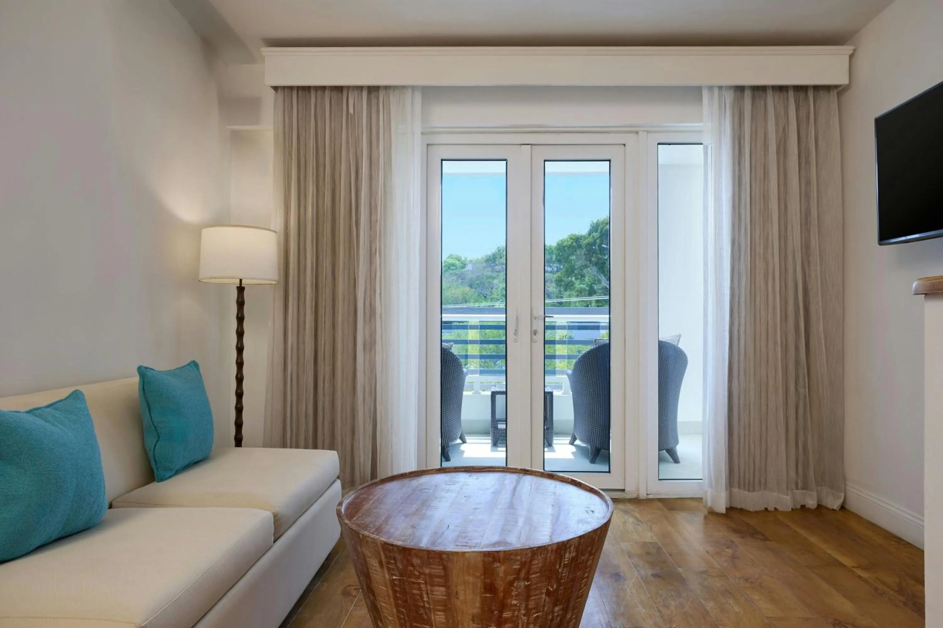 Living room in Waves Resort & Spa, Barbados, An Autograph Collection All-Inclusive Resort