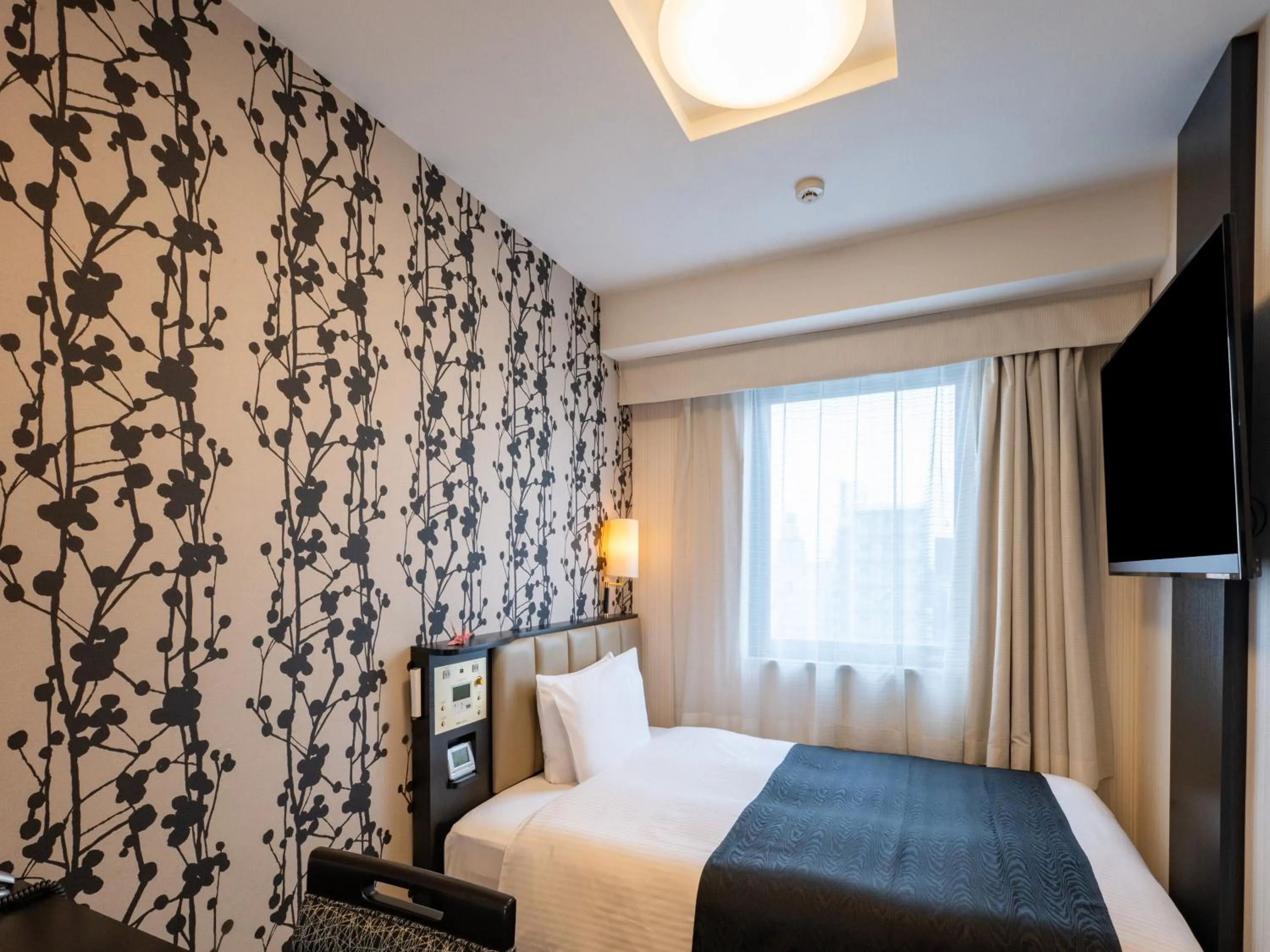 Bed in APA Hotel Nagoya Sakae Higashi