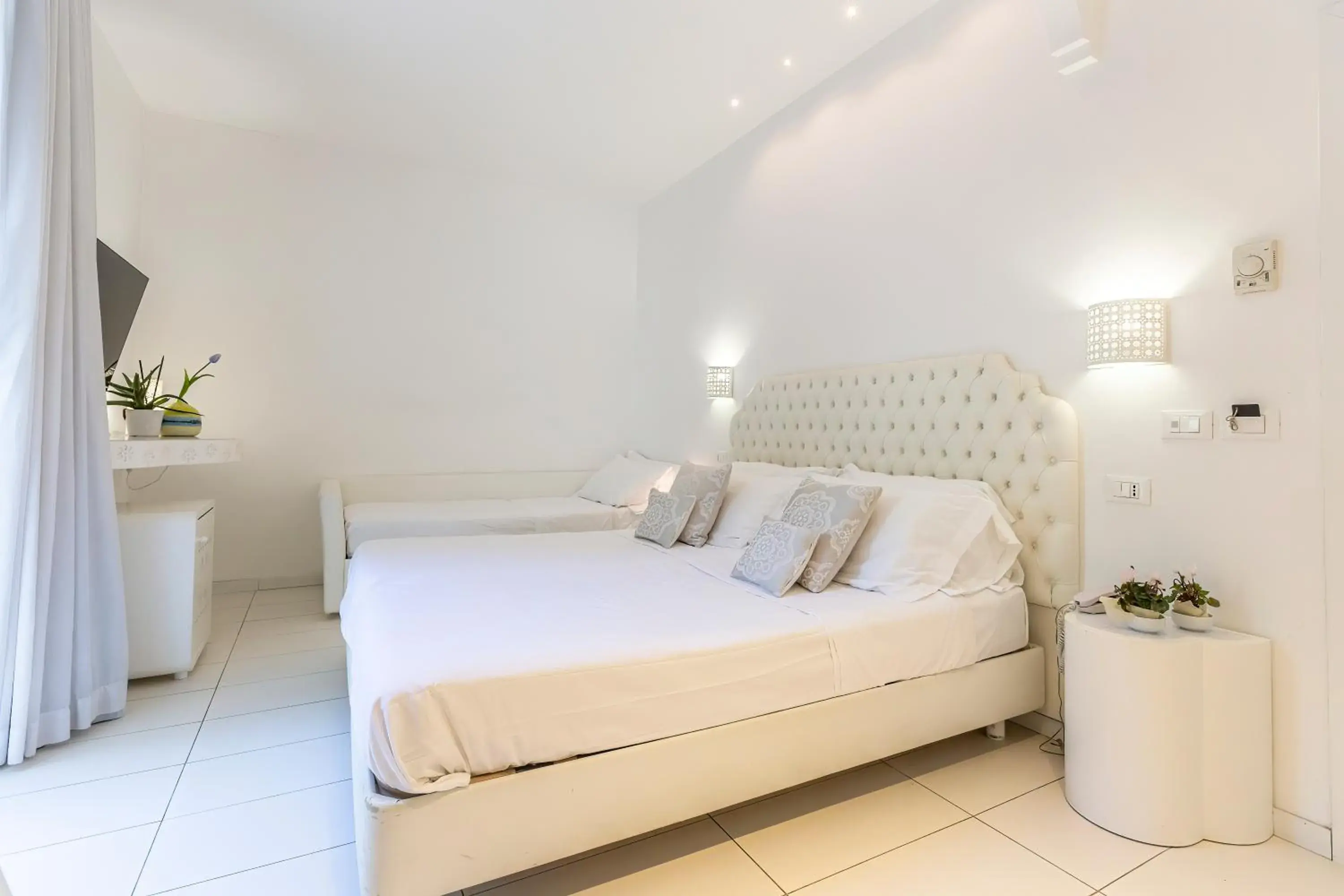 Economy Quadruple Room in Hotel Al Cavallino Bianco Economy Quadruple Room in Hotel Al Cavallino Bianco