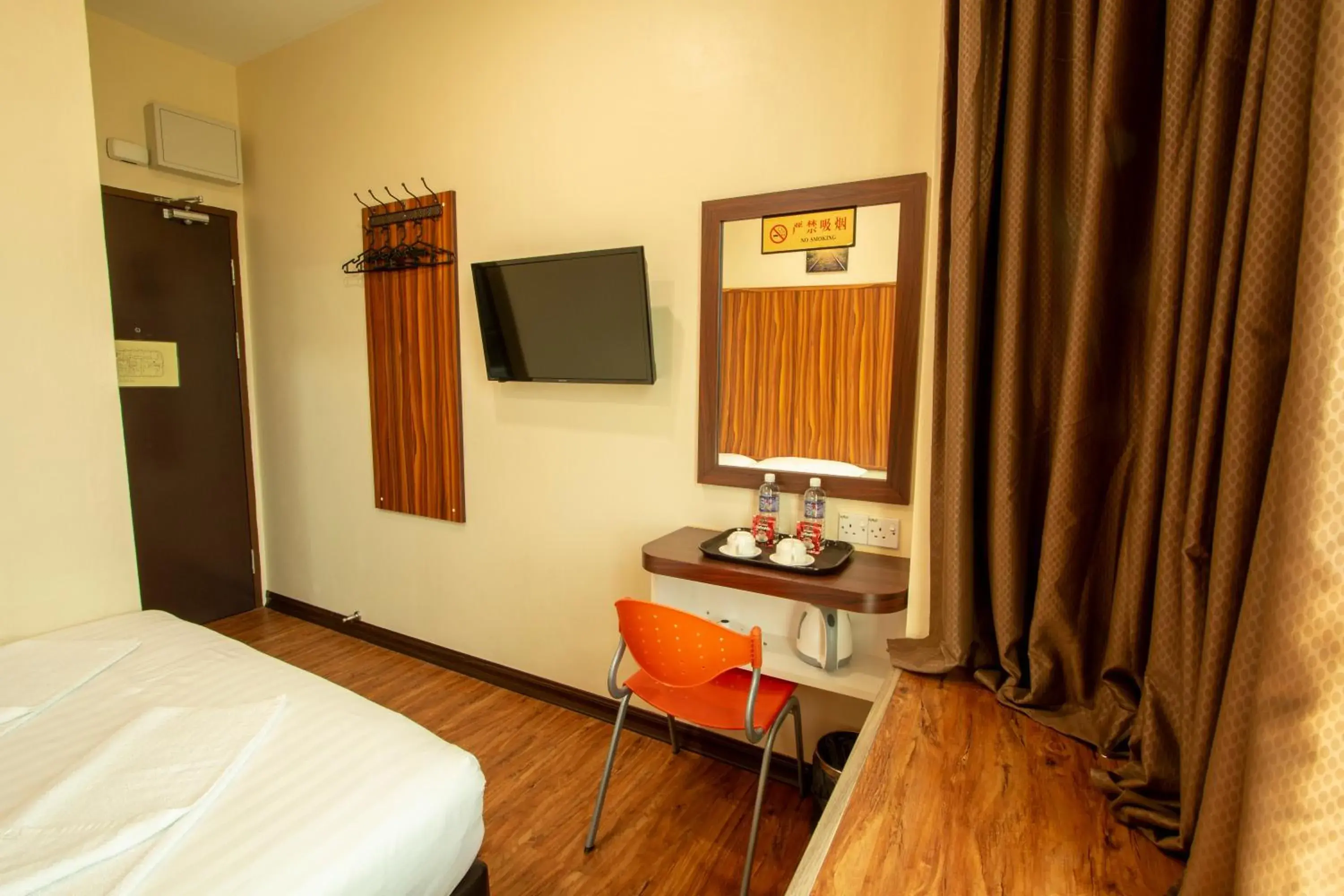 Communal lounge/ TV room, Bed in Expo Hotel Communal lounge/ TV room, Bed in Expo Hotel