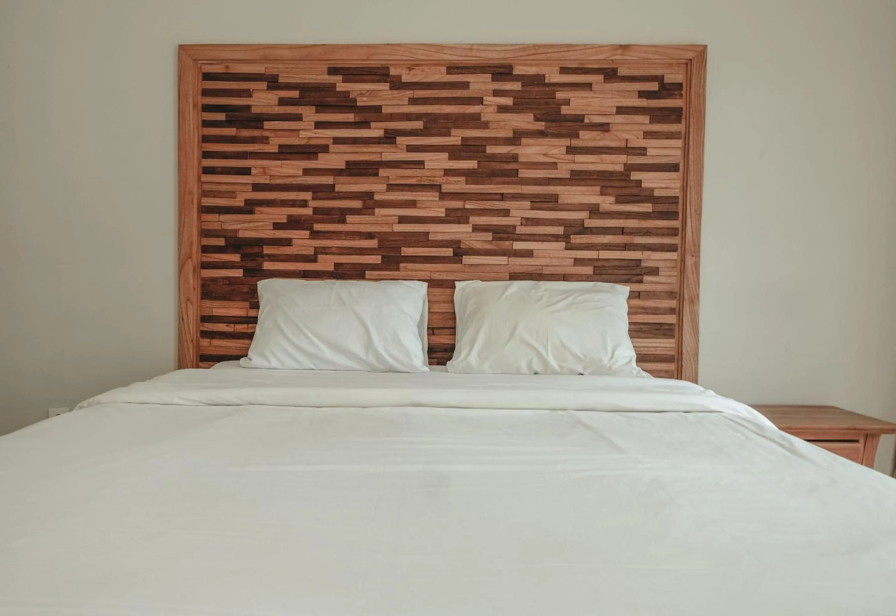 Bed in Sekar Arum Riverside Resort in Canggu