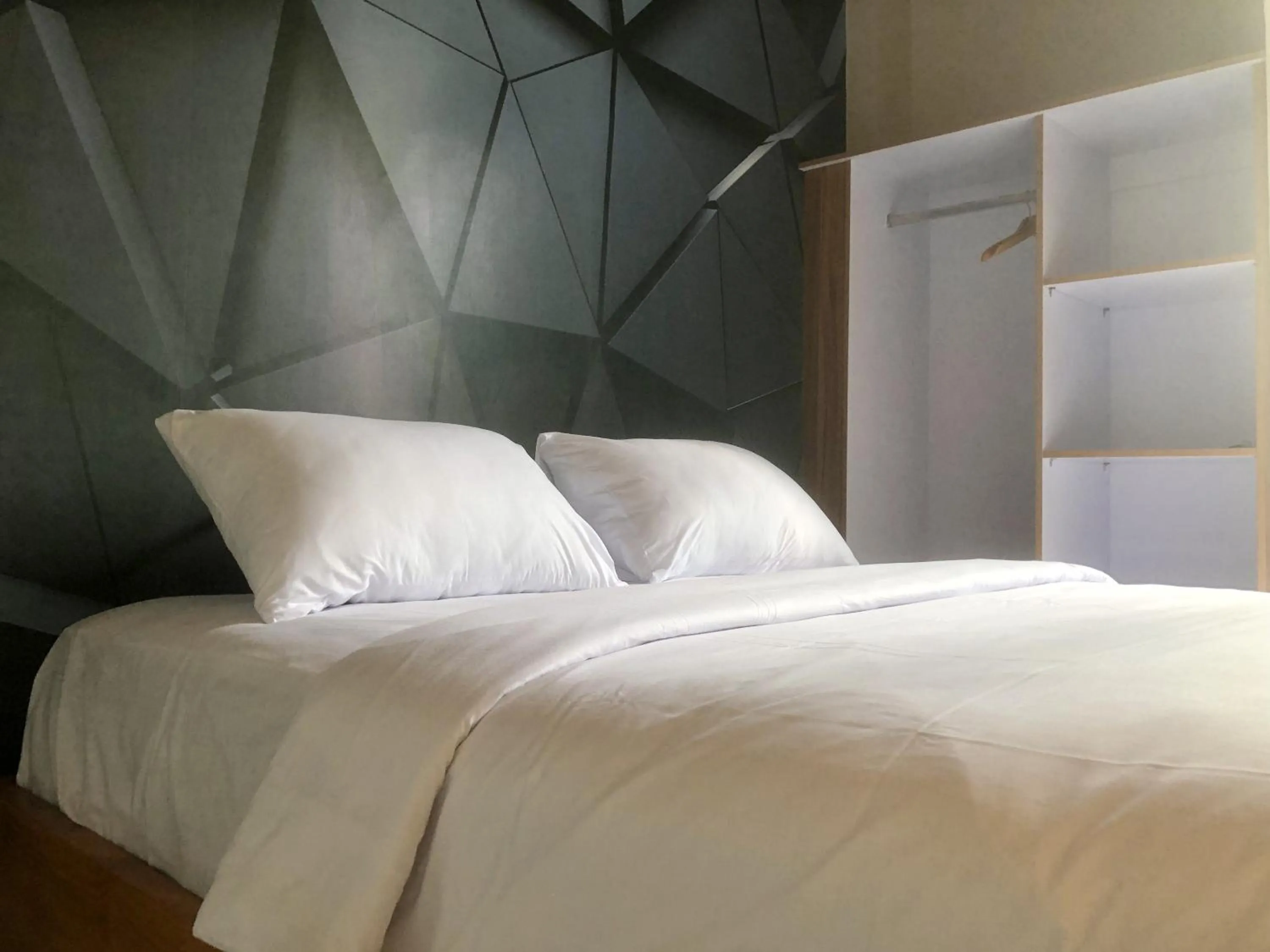 Bed in Sekar Arum Riverside Resort in Canggu