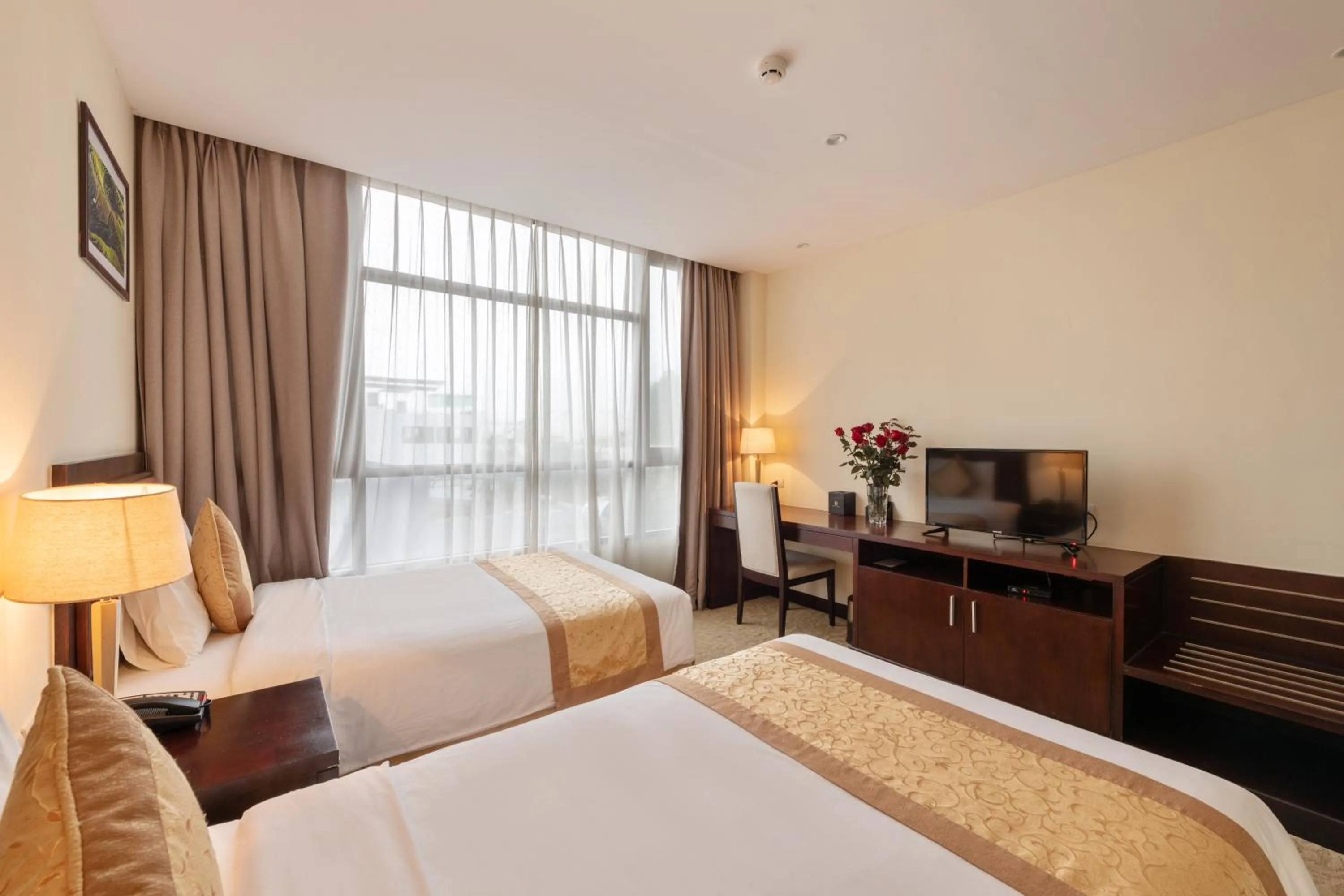 Bed in Red River View Hotel