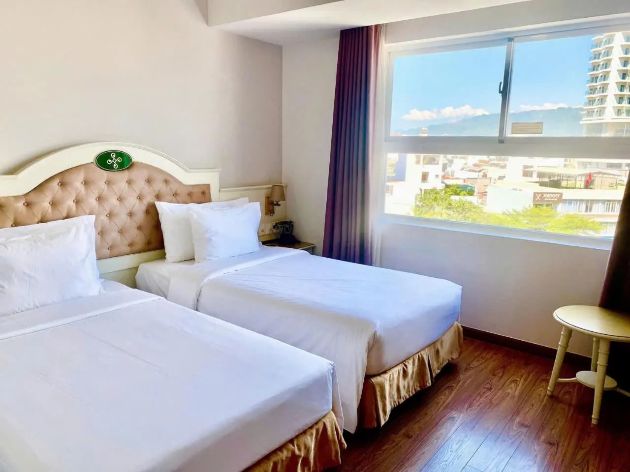 Bed in Isena Nha Trang Hotel