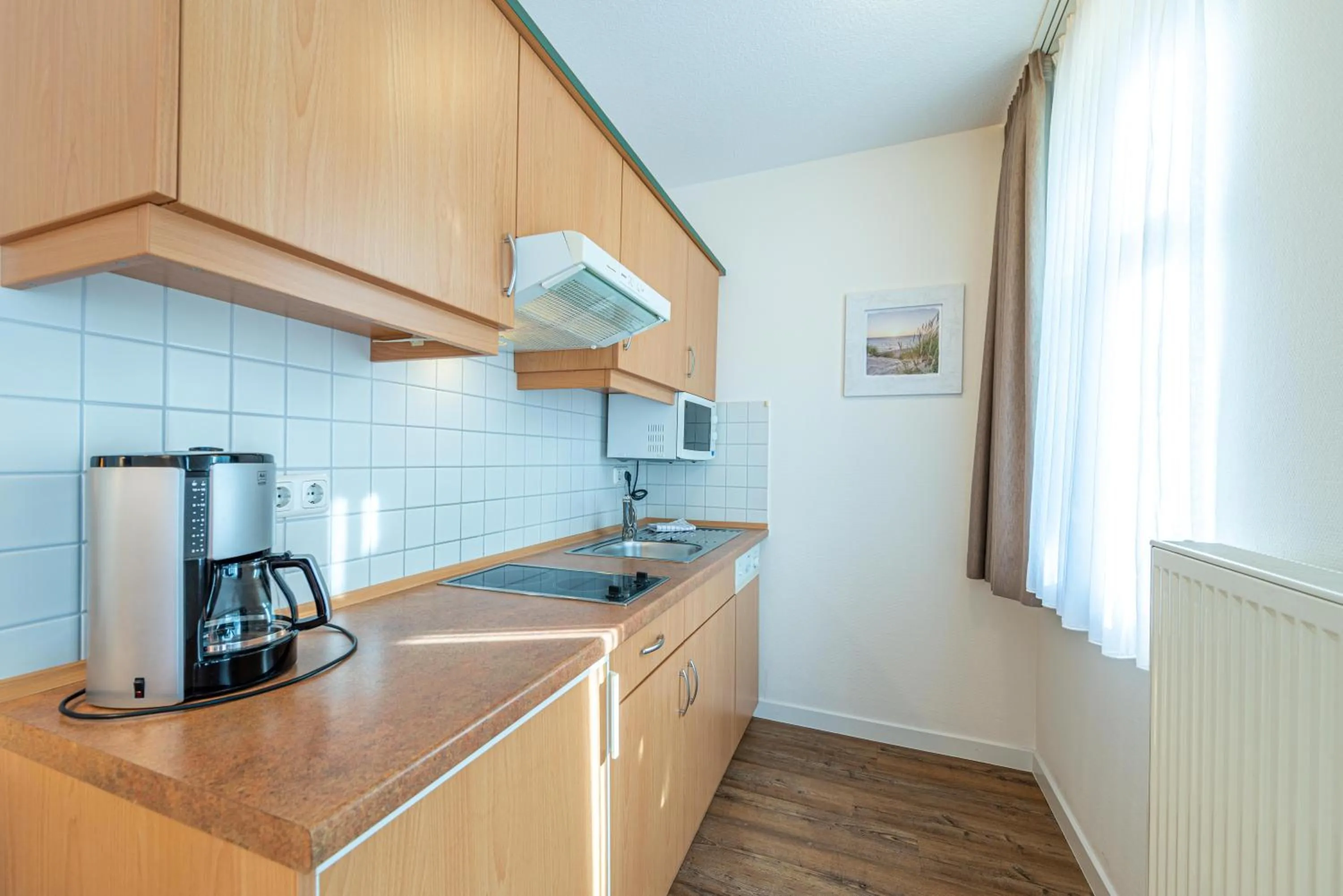 Photo of the whole room in Am Weststrand Apartmenthaus Waldeck