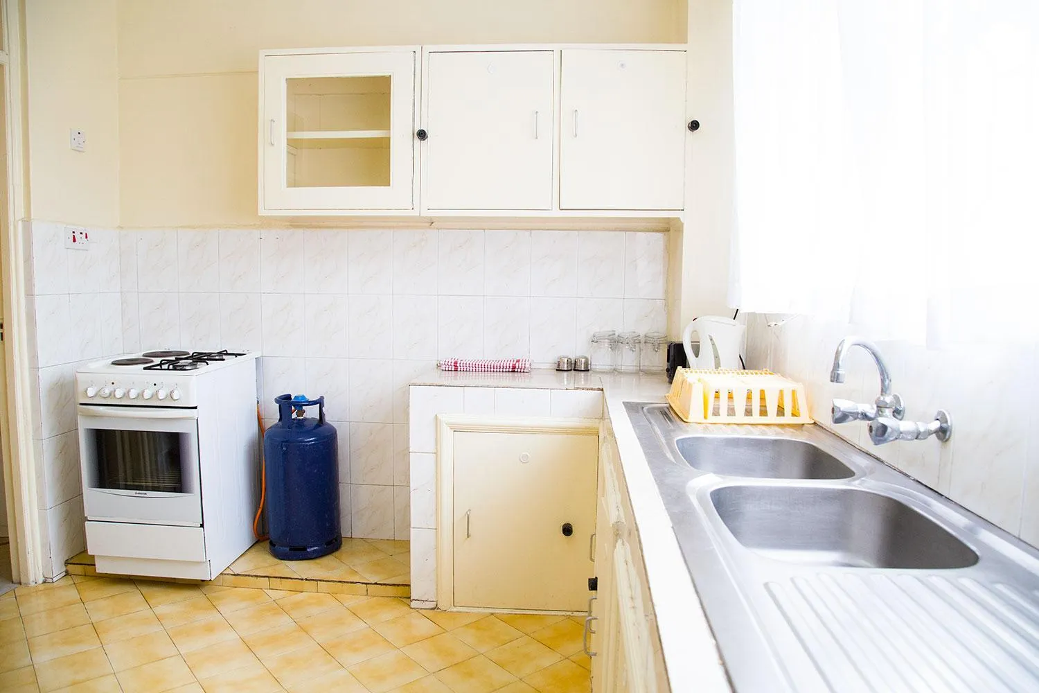 Kitchen or kitchenette in Njema Court Apartment
