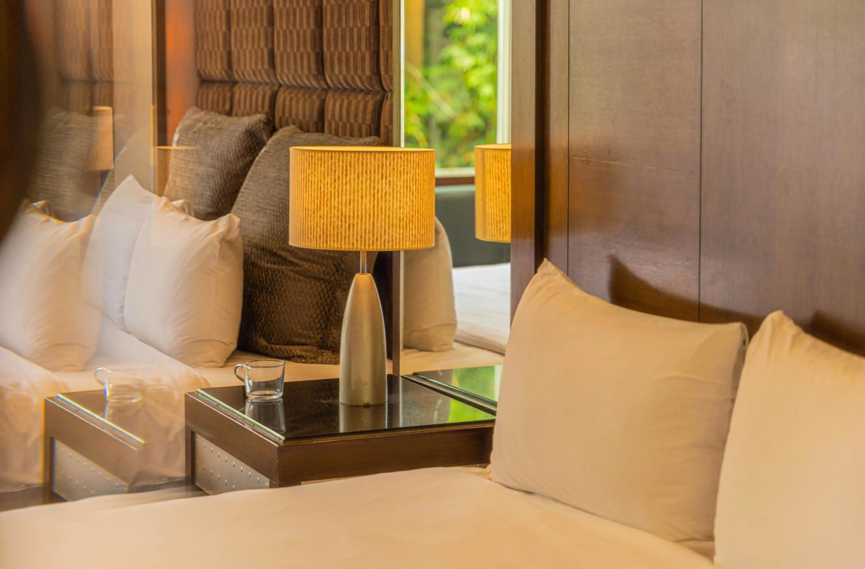 Seating area, Bed in Regale Motel