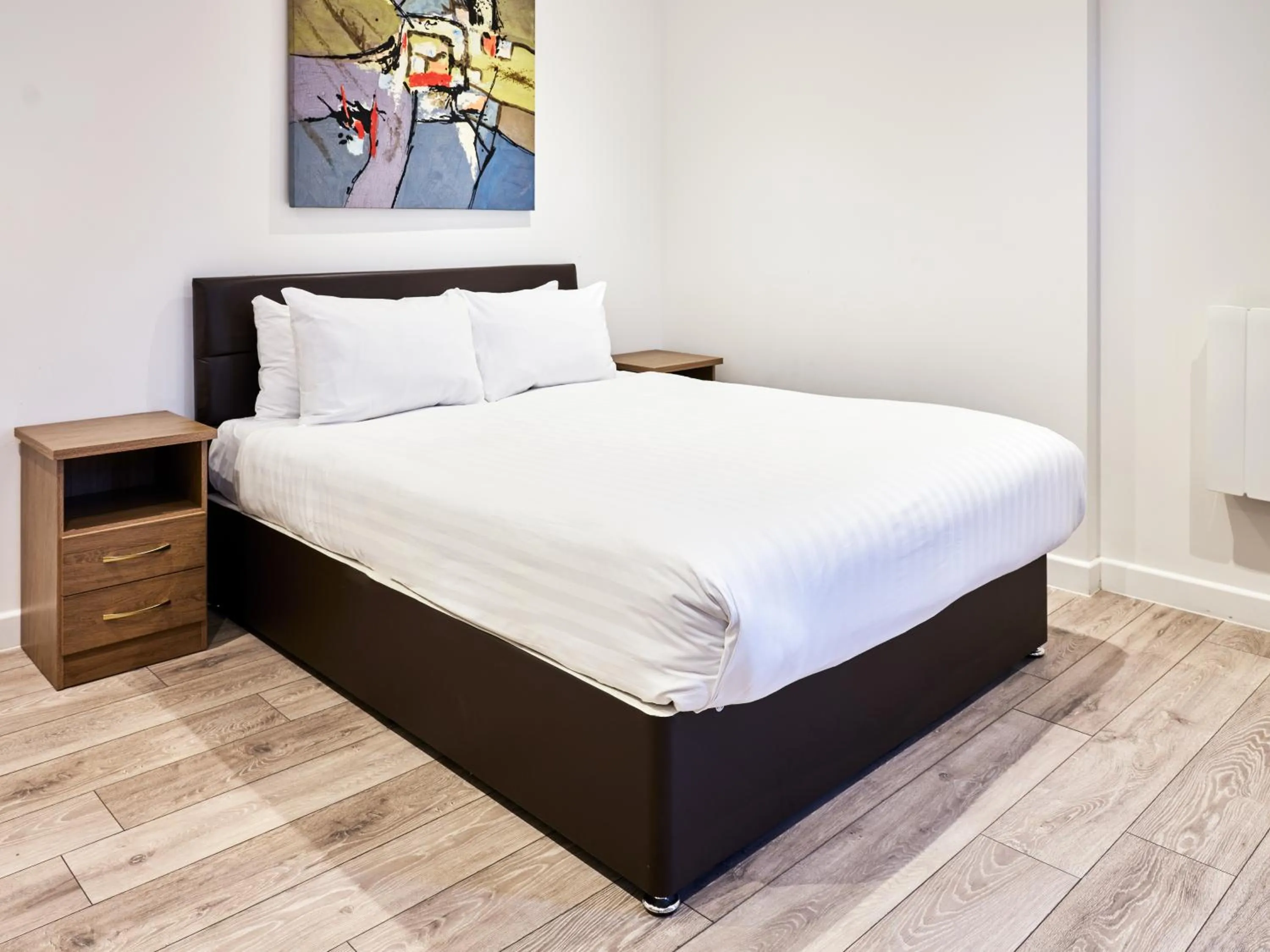 Bed in Hampton Suites Serviced Apartments